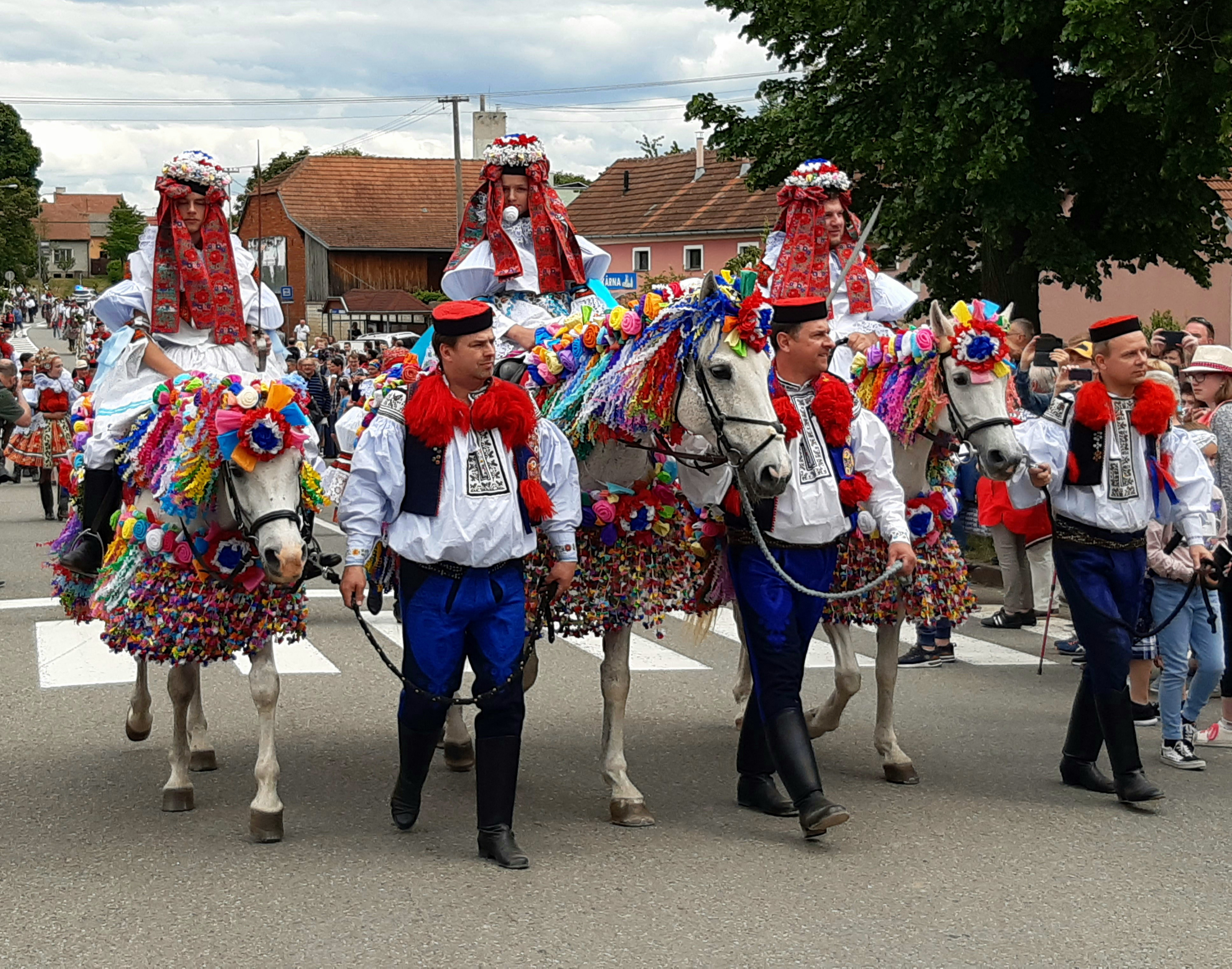 The boy king and his accomplices are led through the village of Vlenov during the annual Ride of the Kings folk festival (Chris Wiltshire/PA)