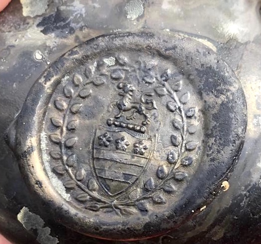 The crest of the Legge family - ancestors of George Washington, the first US President - was found on a bottle with the wreck. (Norfolk Historic Shipwrecks/ PA)