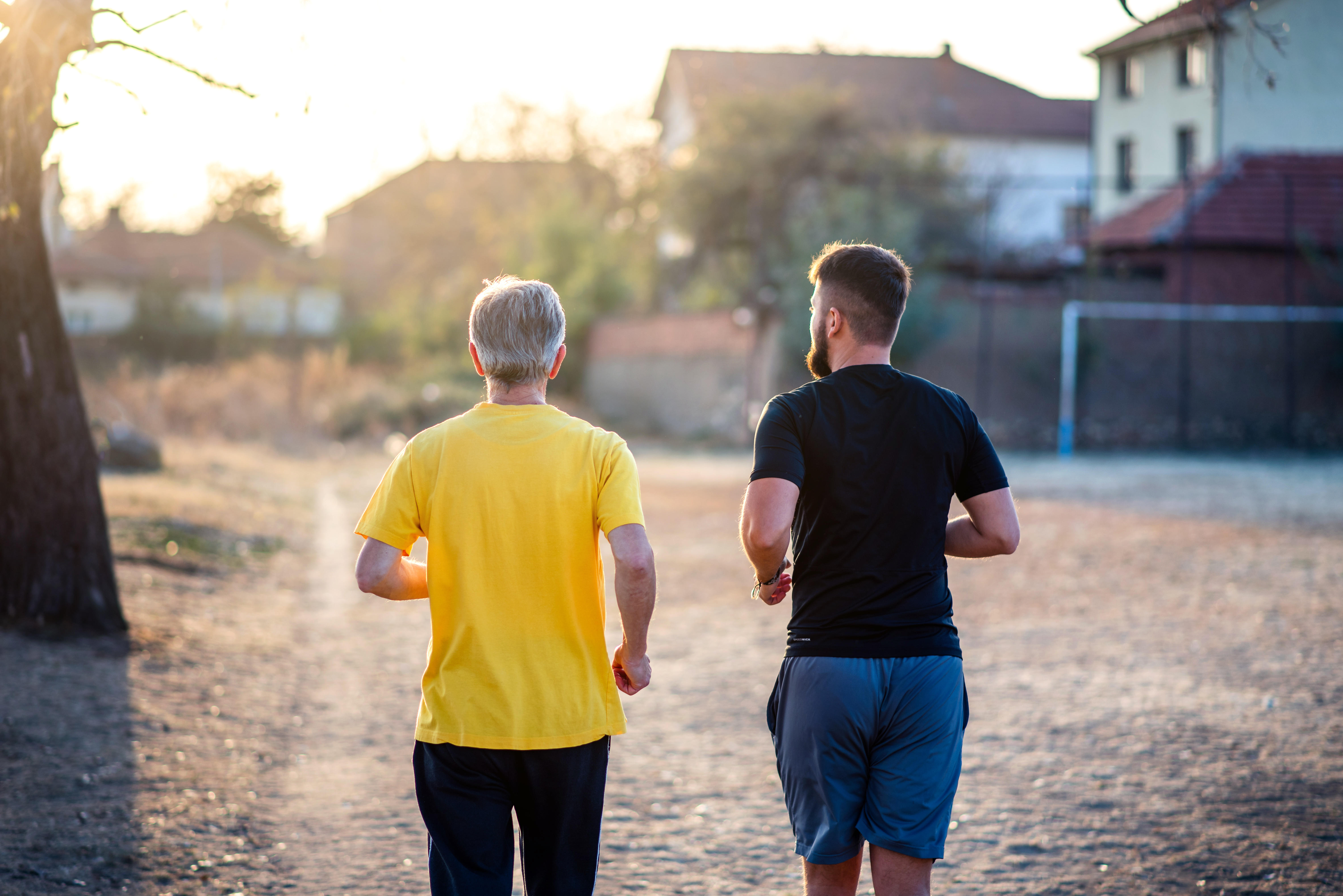 Two men running in a park