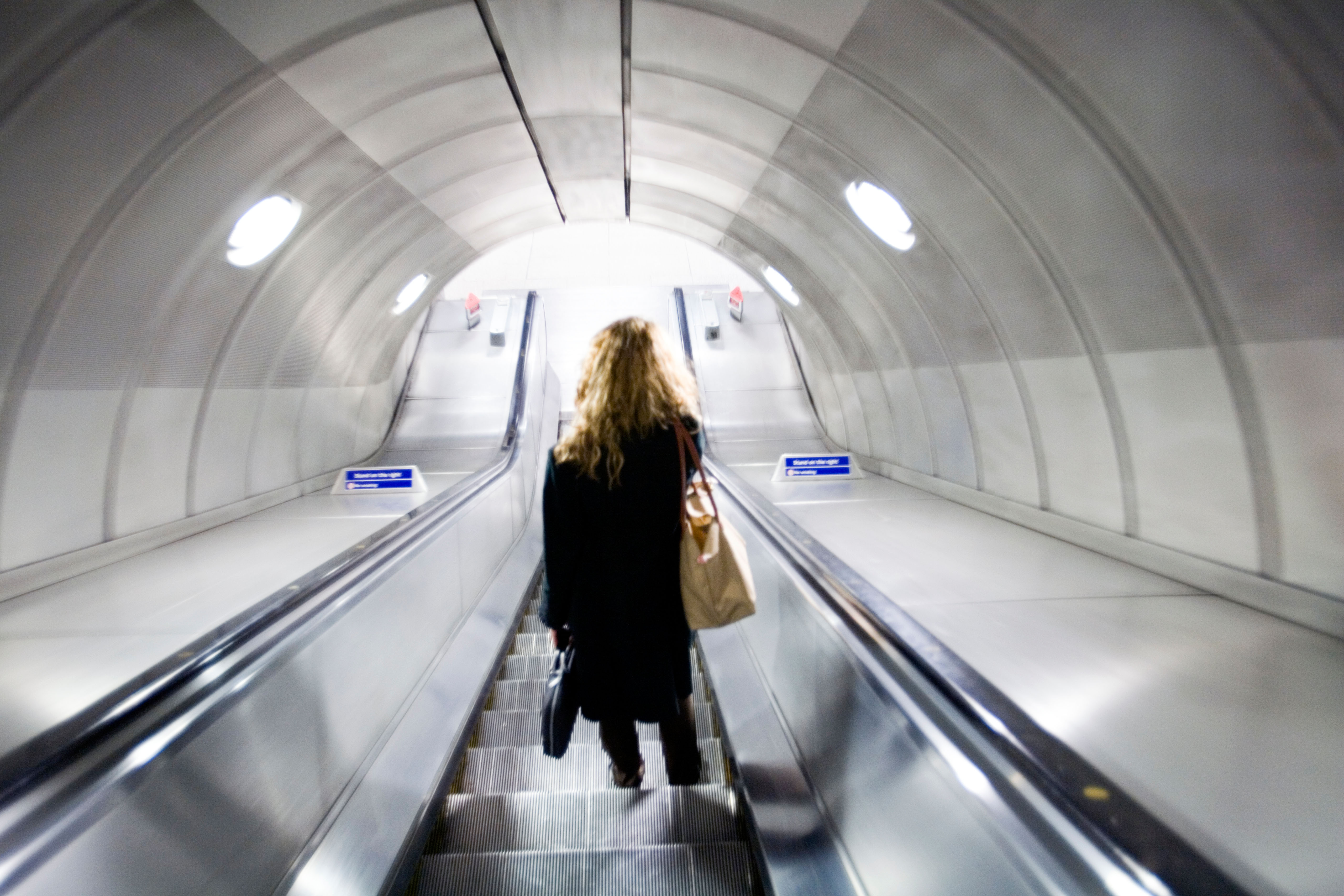 Woman on elevator, London underground