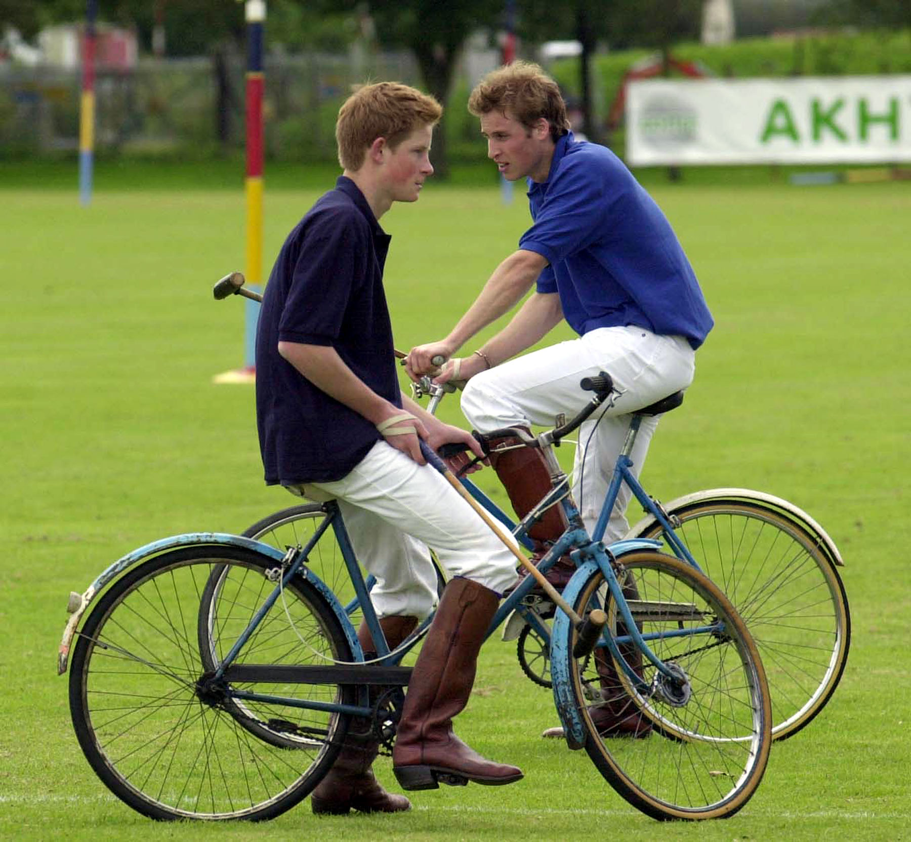 Prince Harry and Prince William take a break whilst playing in the bicycle part of the Jockeys v Eventers Charity polo match 