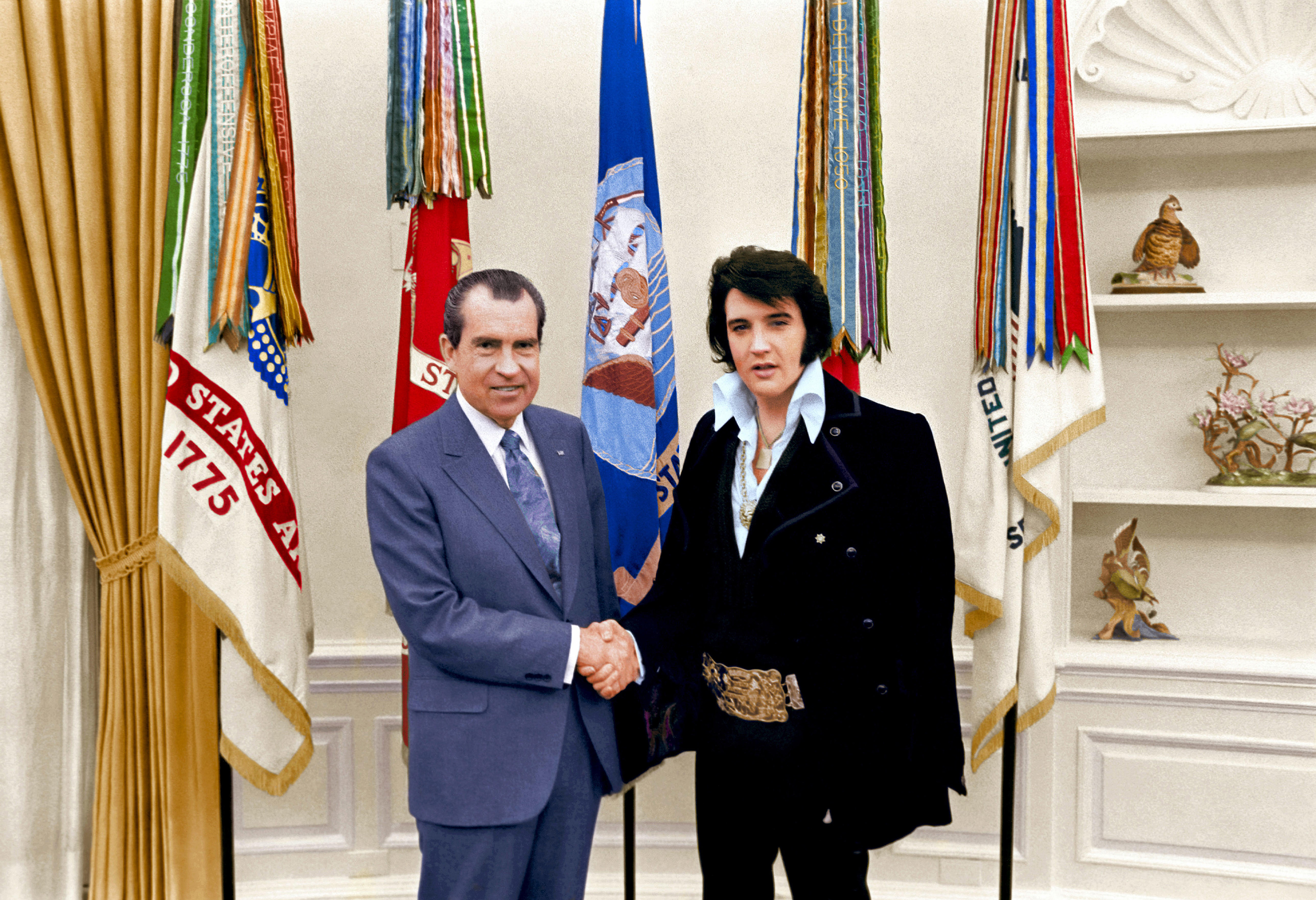 Elvis Presley shakes hands with U.S President Richard M. Nixon