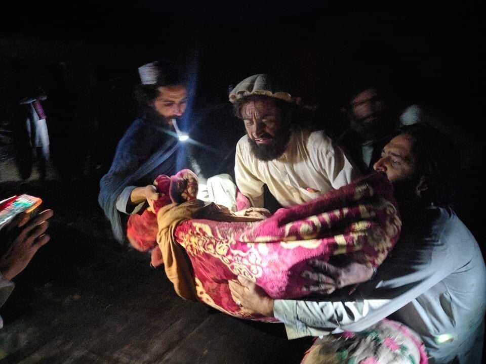 Afghans evacuate a person wounded in an earthquake in the province of Paktika, eastern Afghanistan