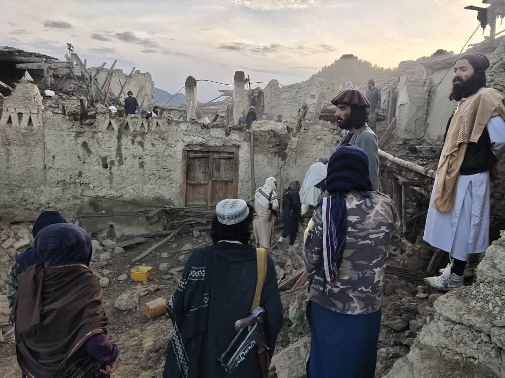 Afghans look at the destruction