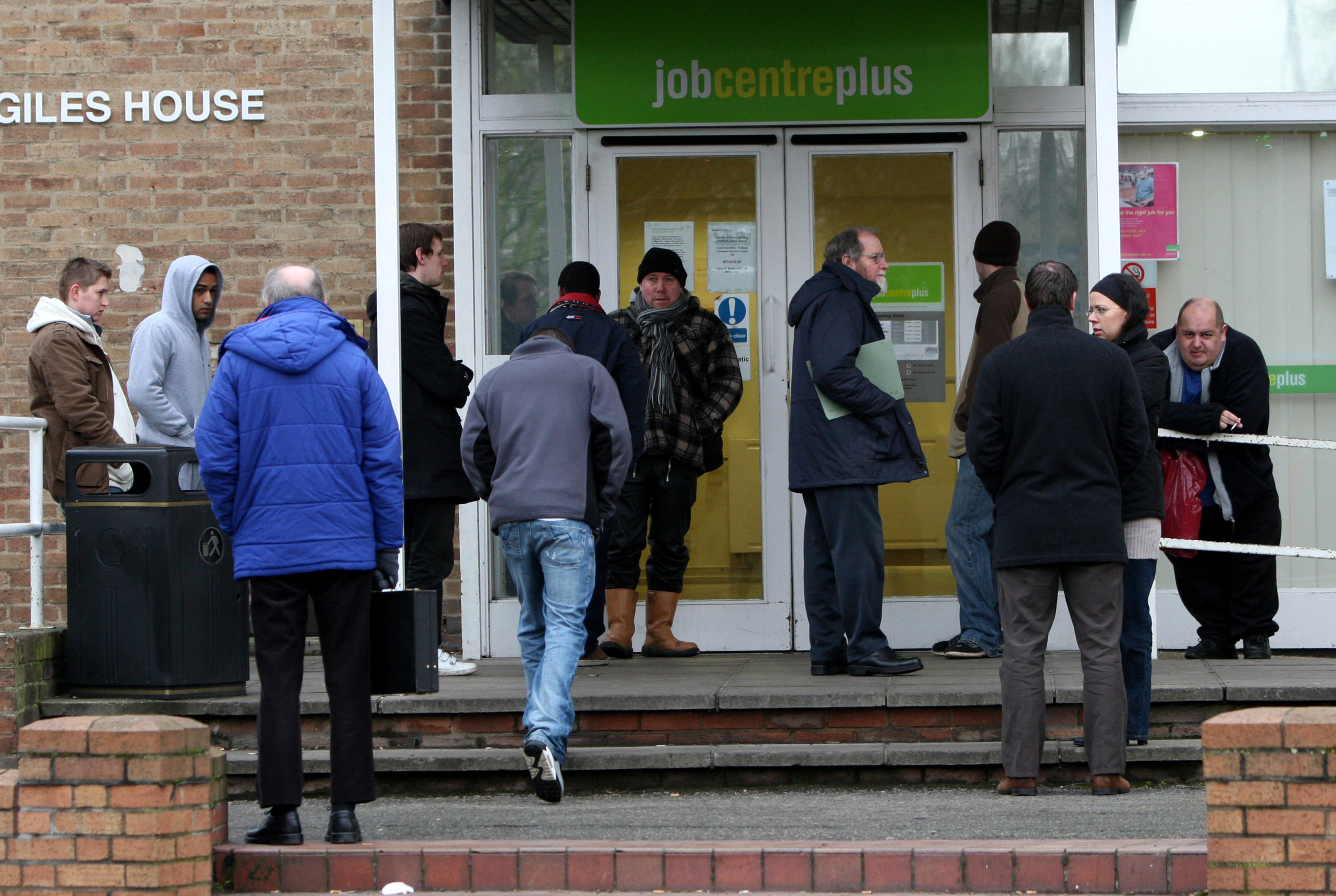People queue outside a Job Centre 