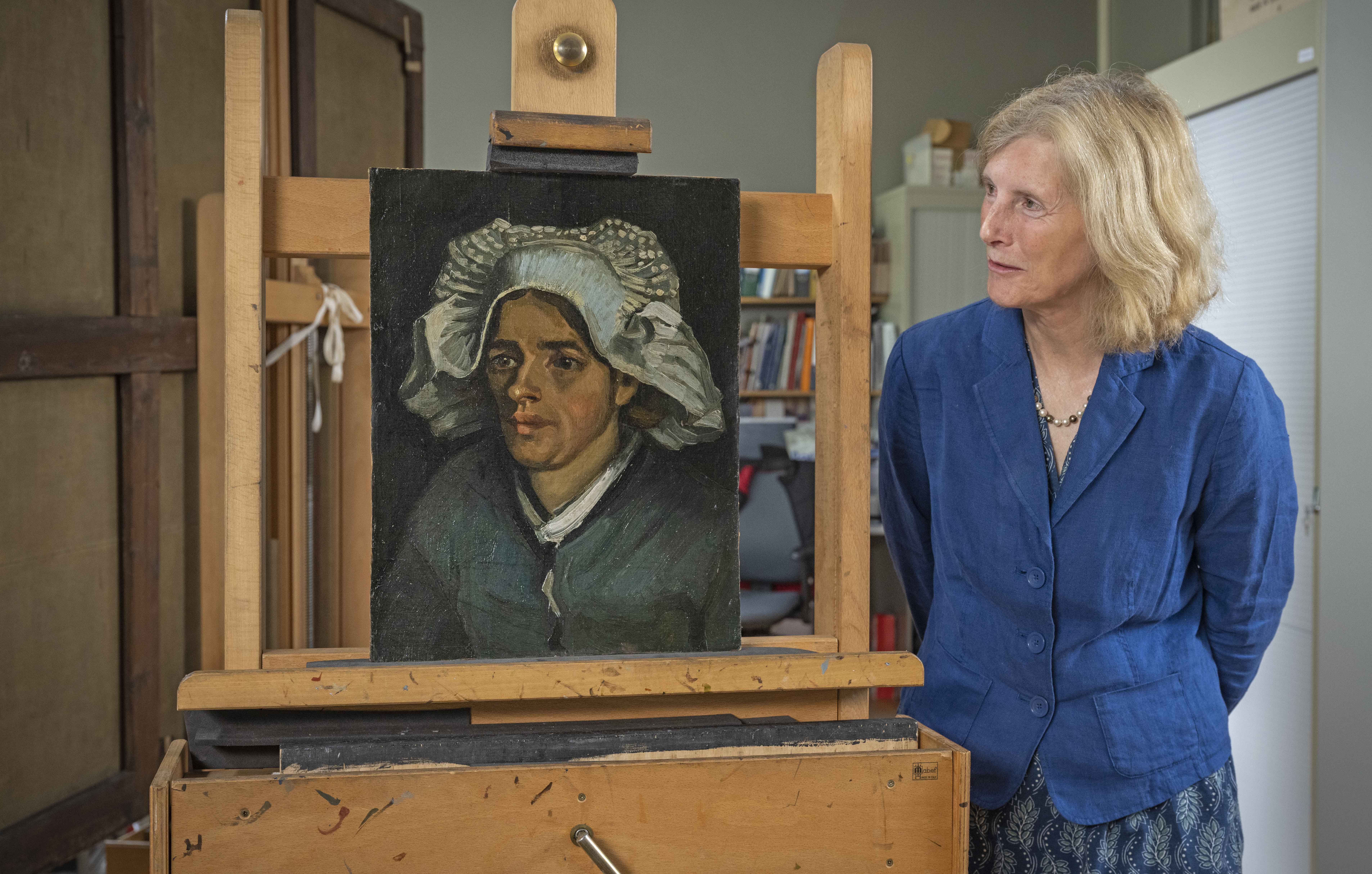 Senior Curator Frances Fowle views Head of a Peasant Woman
