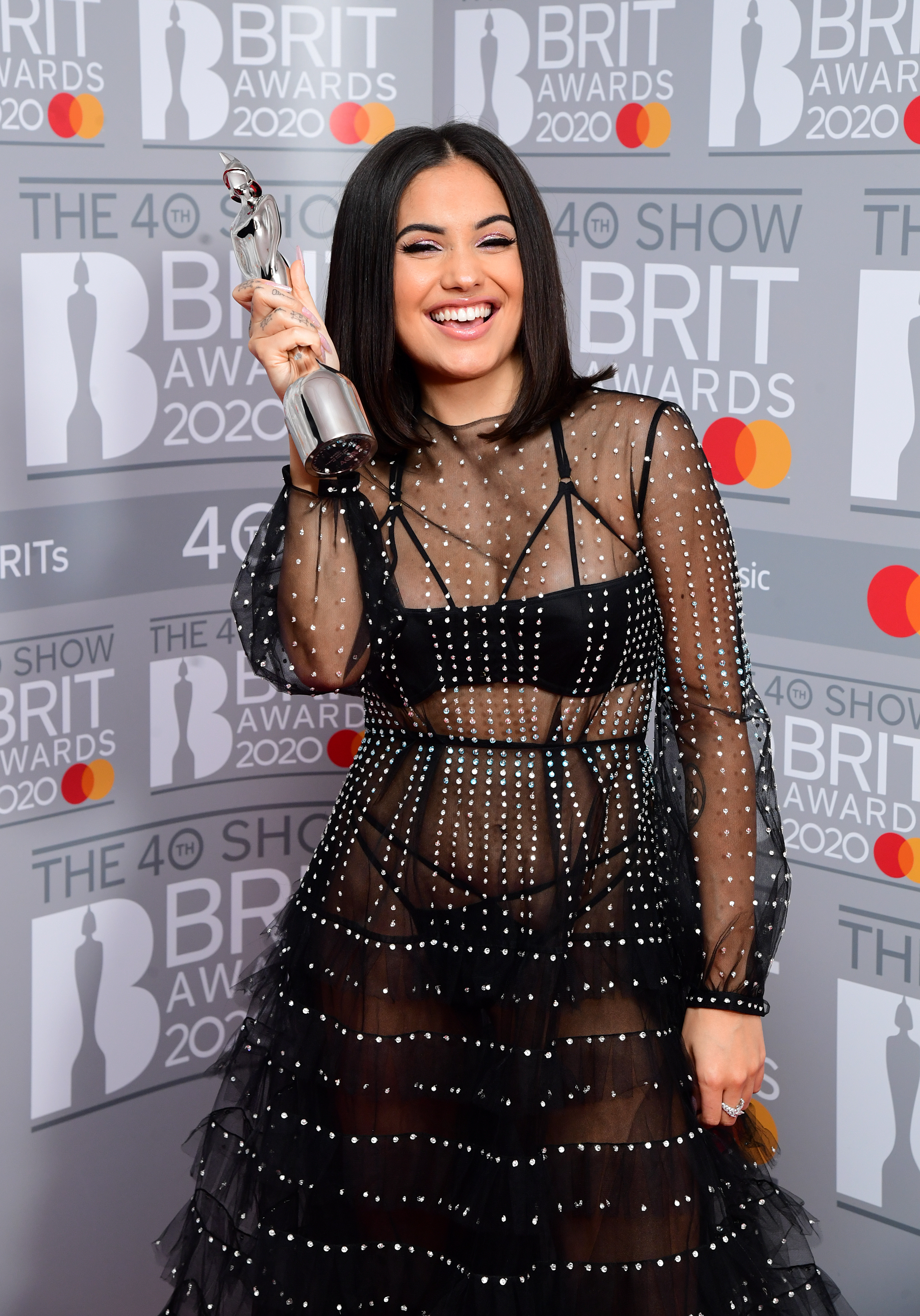 Mabel with her Brit Award for Best British Female