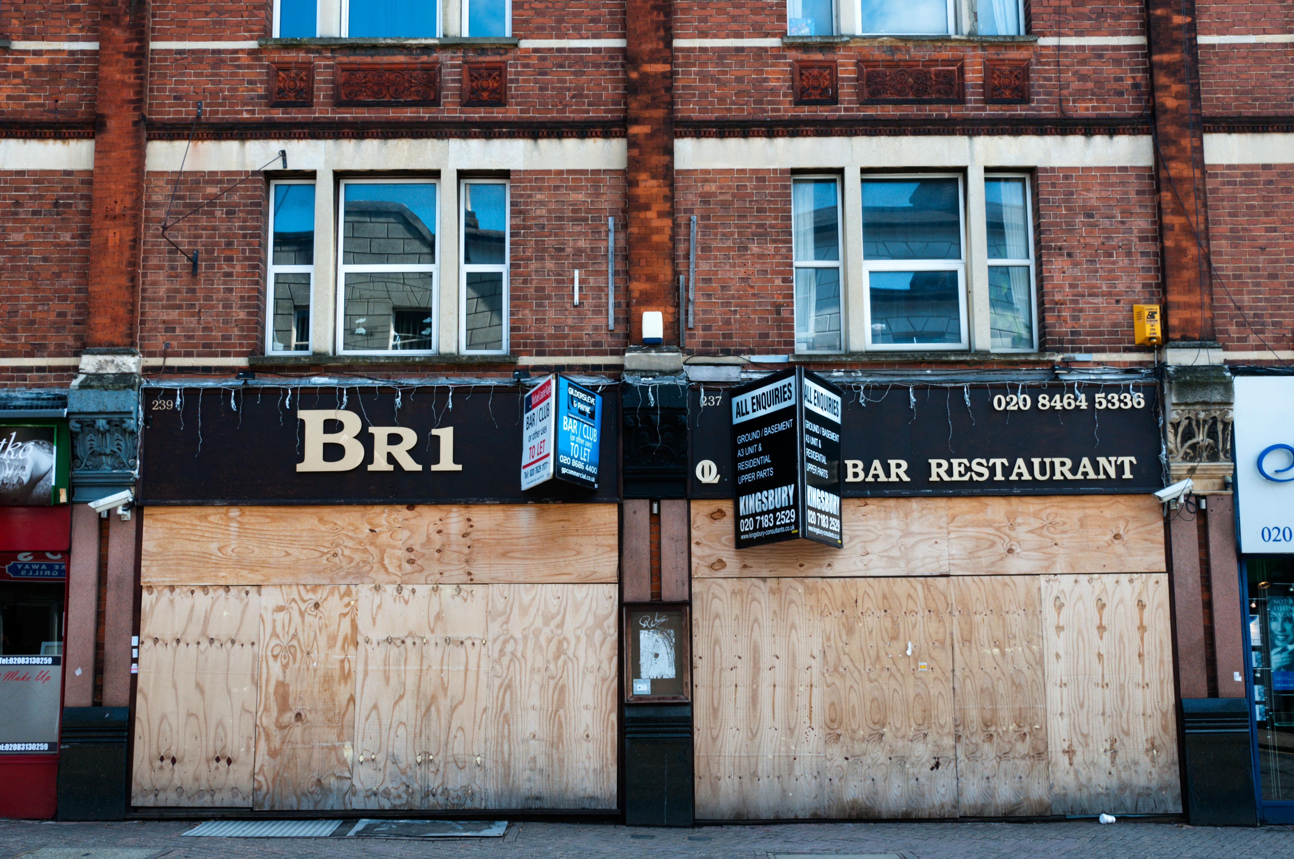 A closed and boarded-up bar in south London