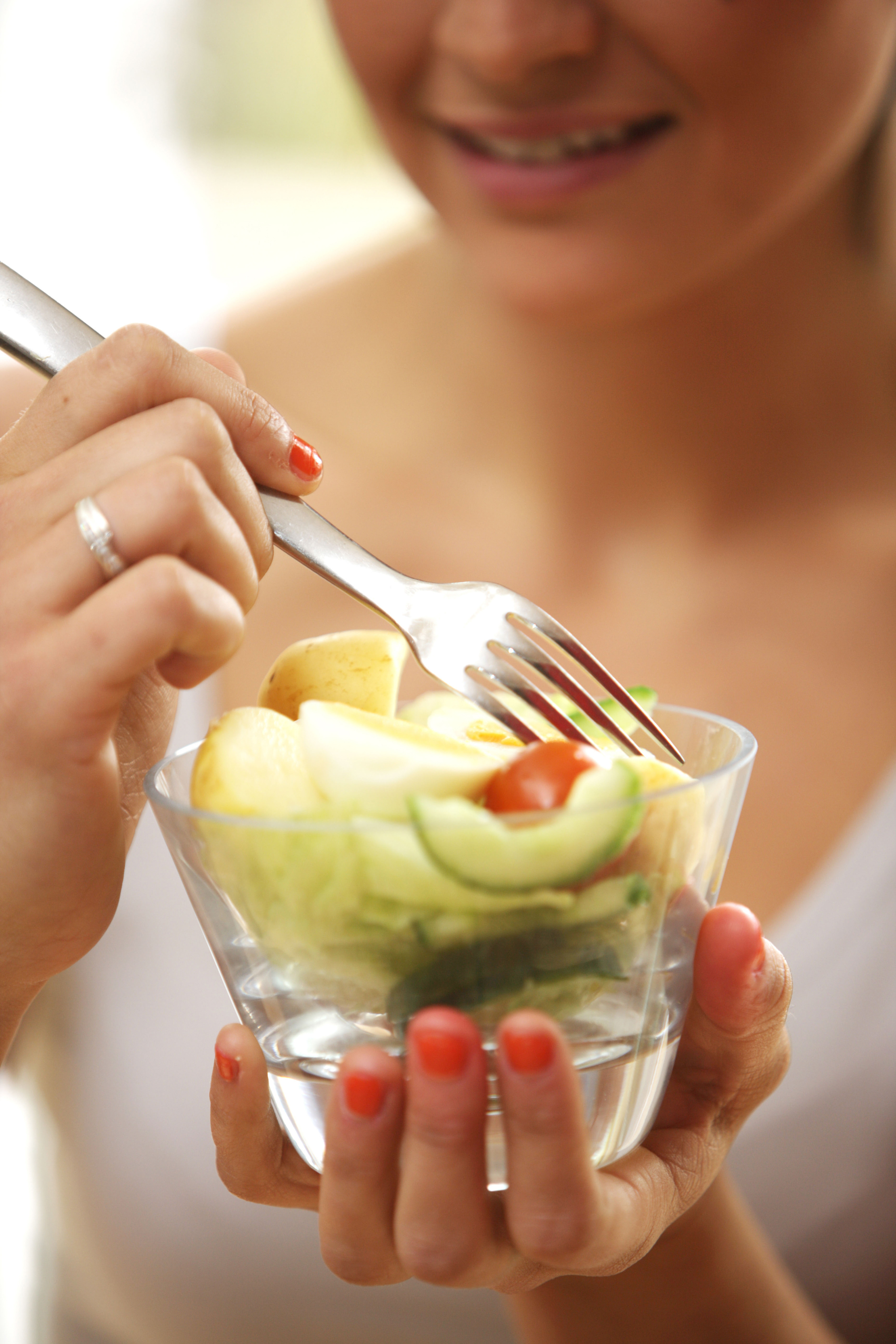 woman eating potato salad