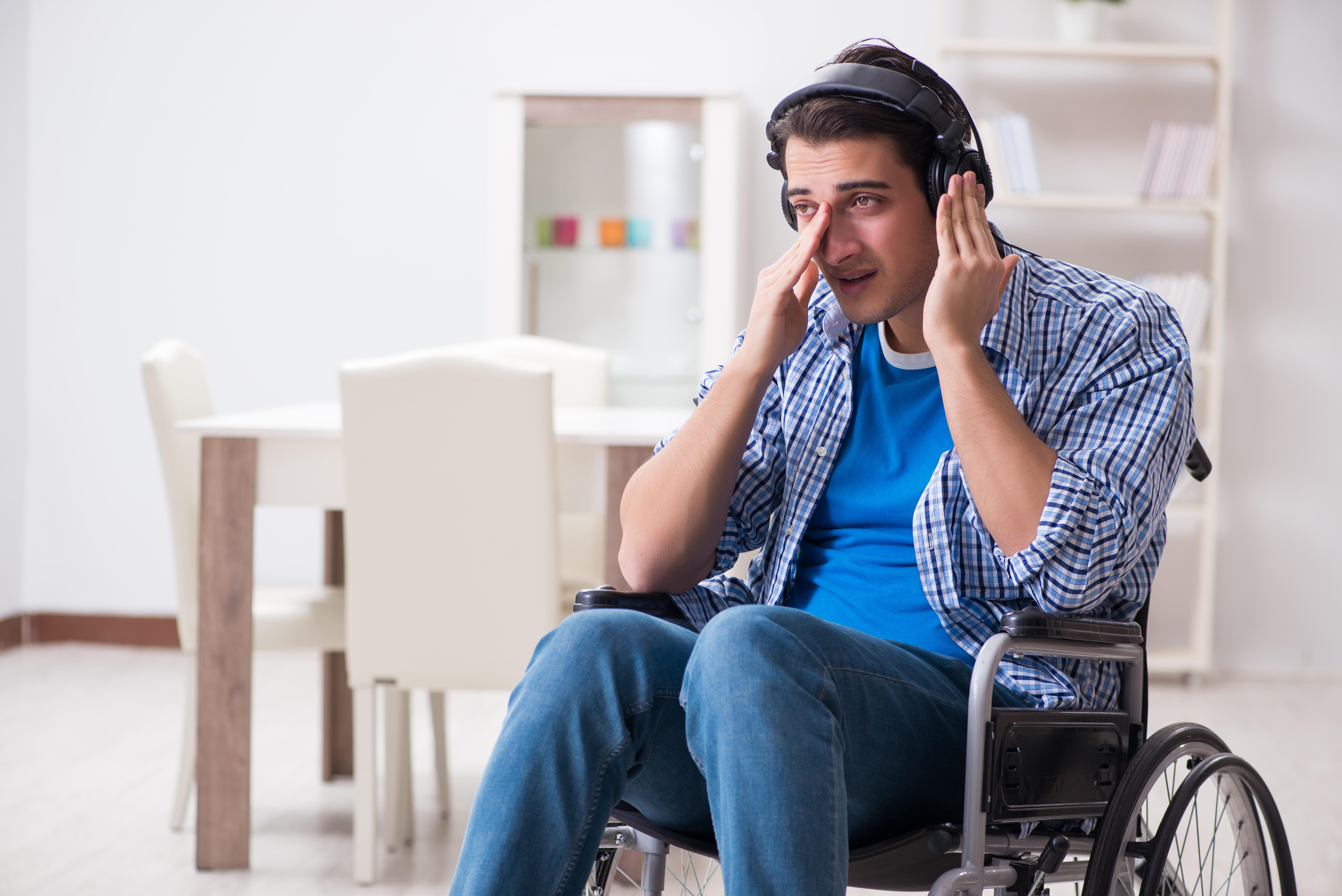 Man crying listening to music