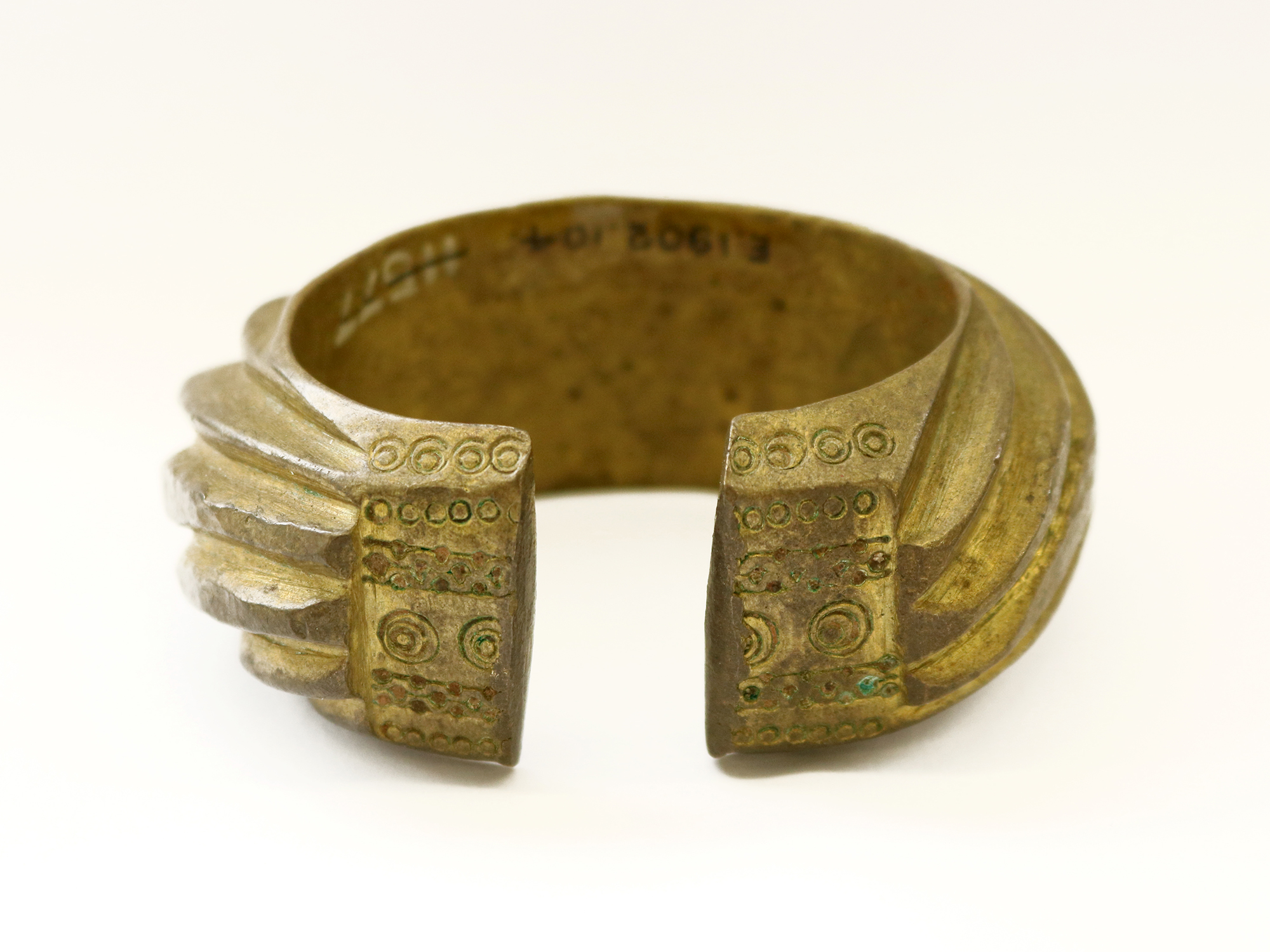 A brass penannular bracelet 