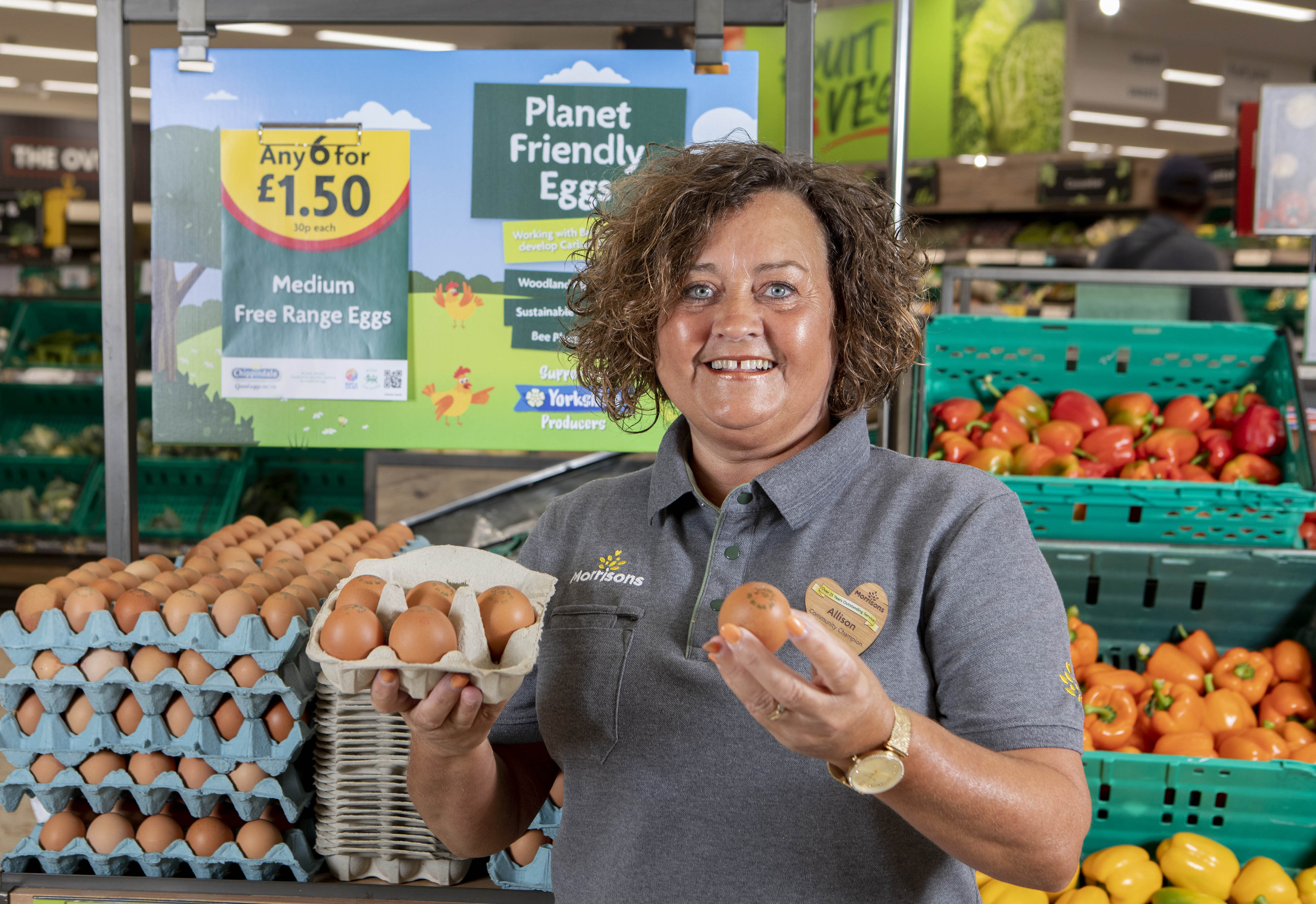 Allison Audsley holds a ‘Planet Friendly Egg’ at a branch of Morrisons near Hull (Lucy Ray/PA)