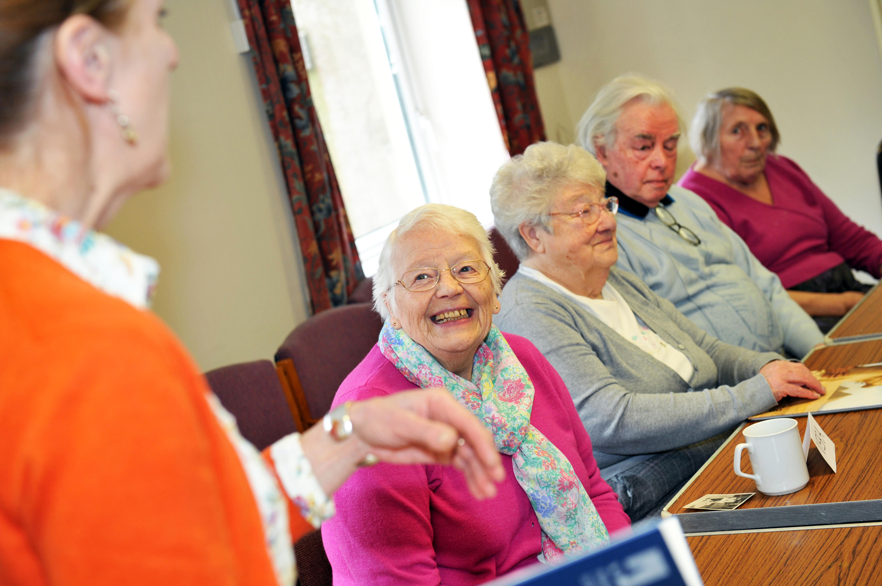 Elderly people take part in a dementia care workshop