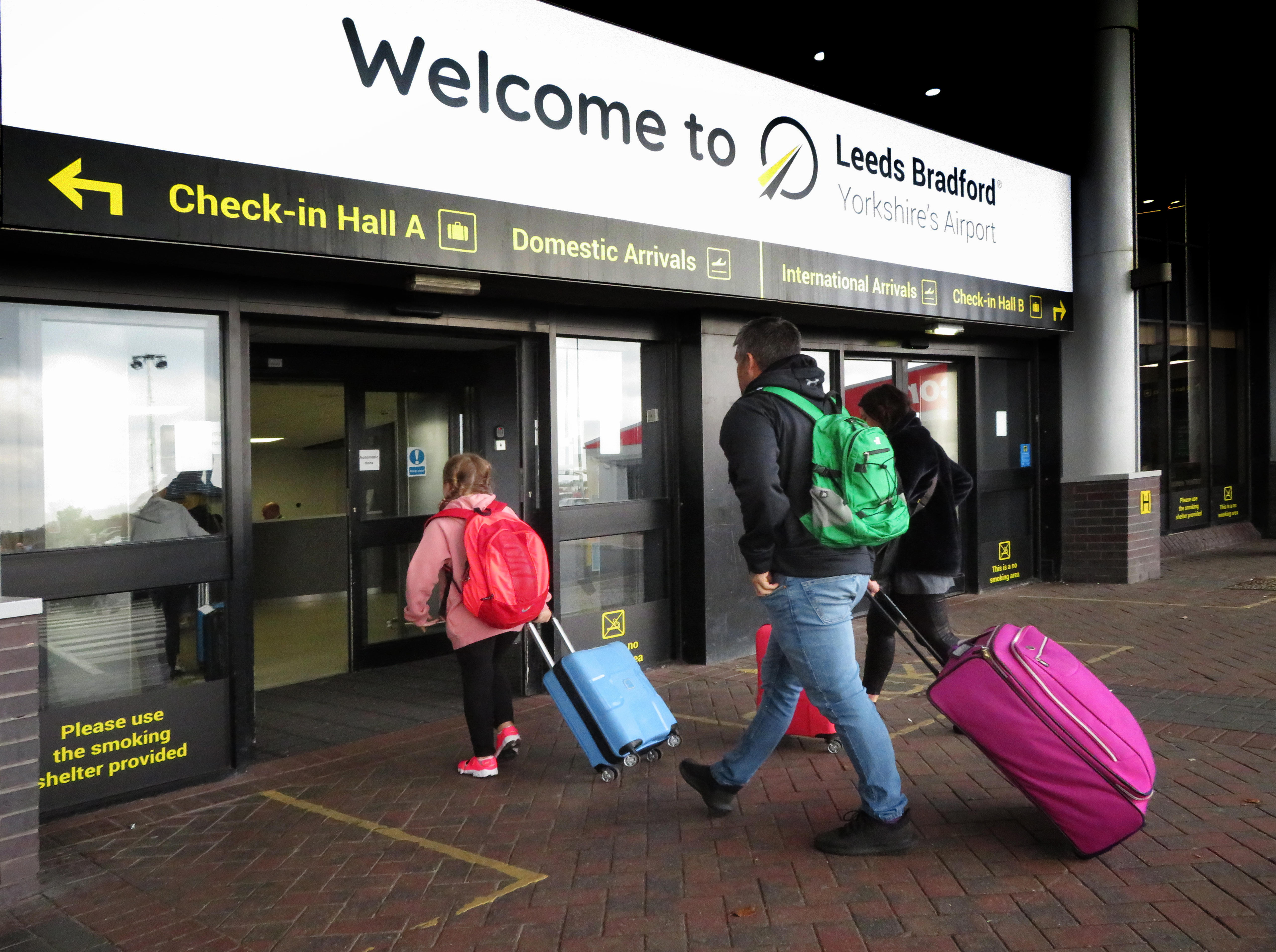Passengers arrive at Leeds Bradford Airport