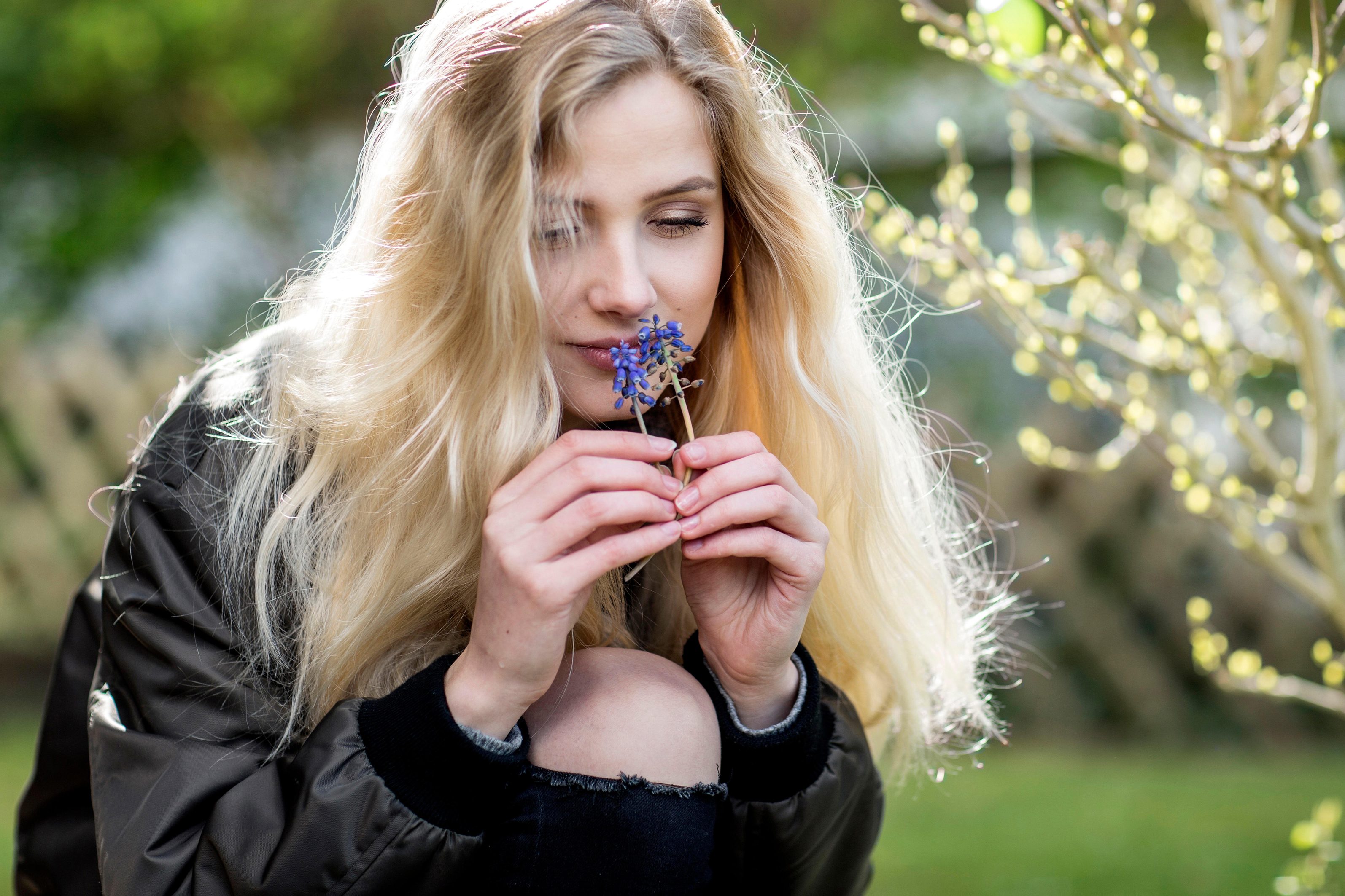  woman smelling grape hyacinths (Alamy/PA)