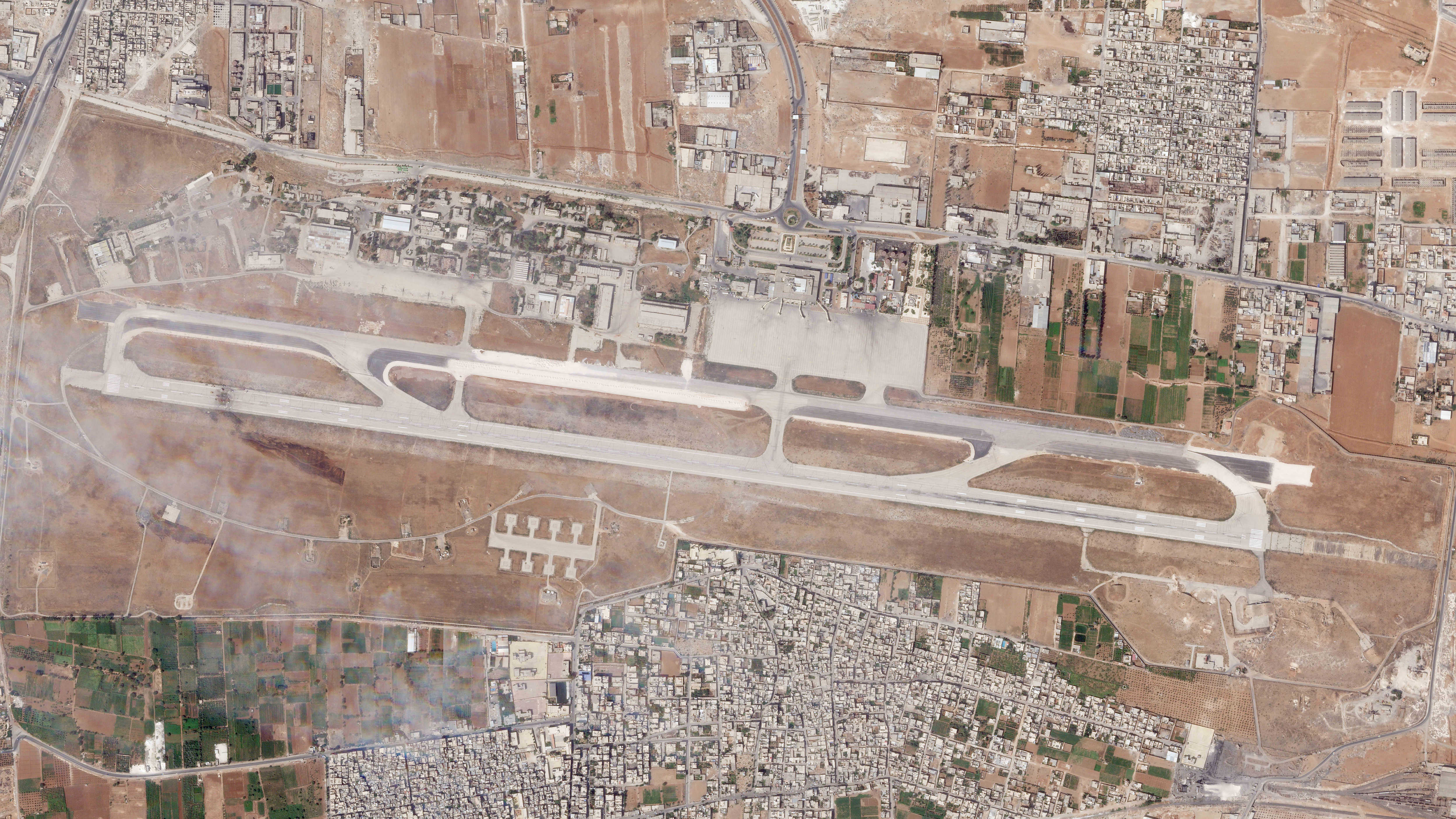 An Israeli attack targeting a Syrian airport tore a hole in the runway and also damaged a nearby piece of tarmac and structure on the military side of the airfield
