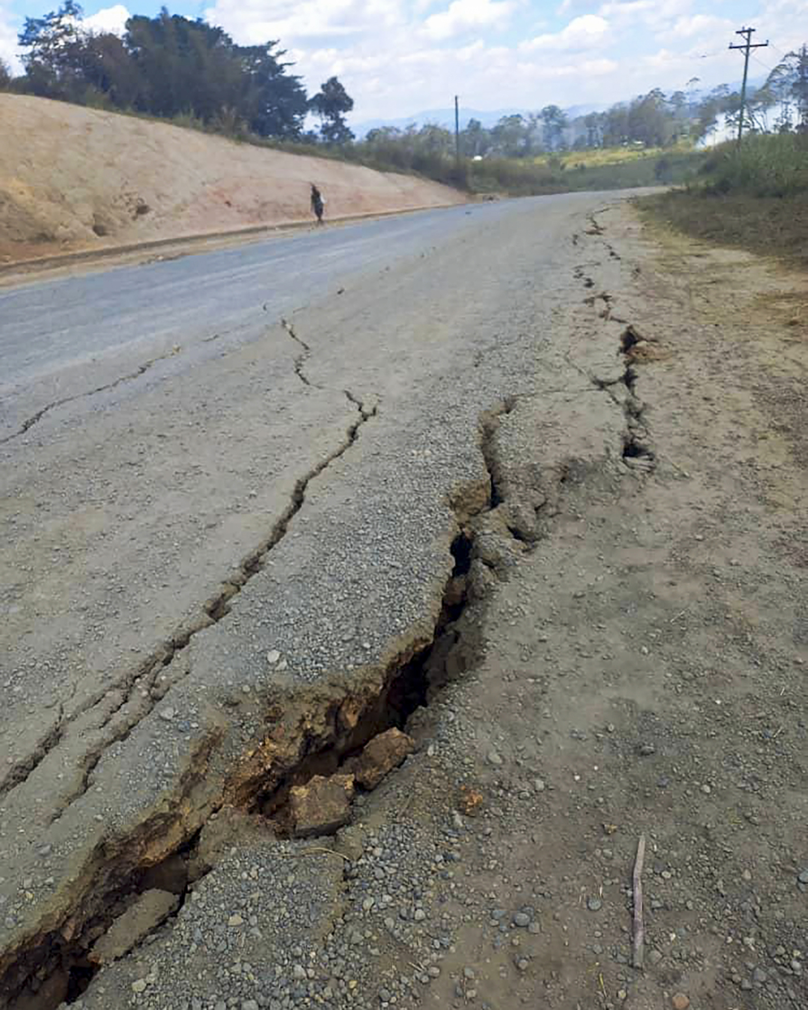 Debris lies strewn across a highway following a landslide near the town of Kainantu