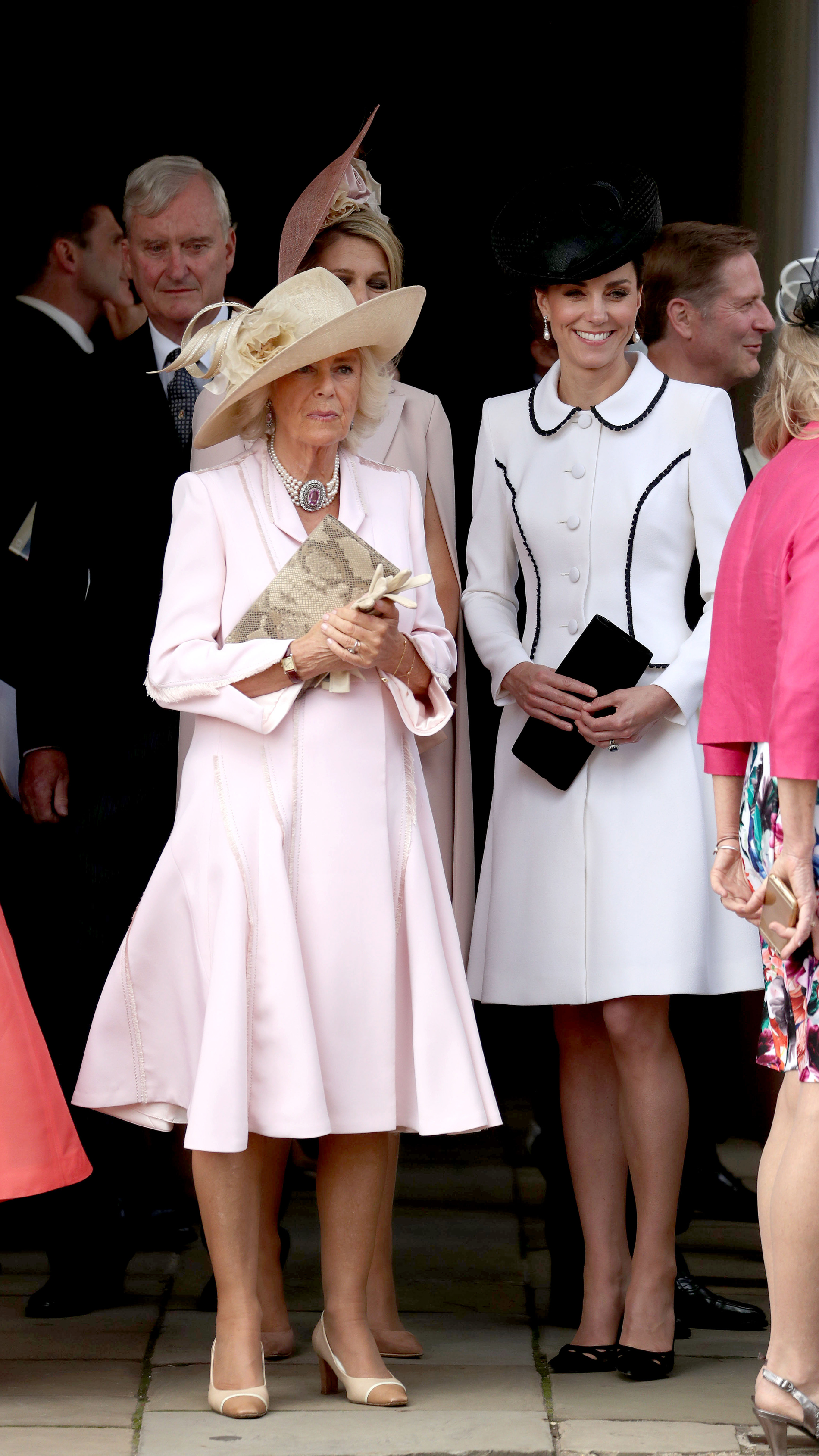 The Duchess of Cornwall (left) and the Duchess of Cambridge, stand together as they watch the annual Order of the Garter Service at St George's Chapel