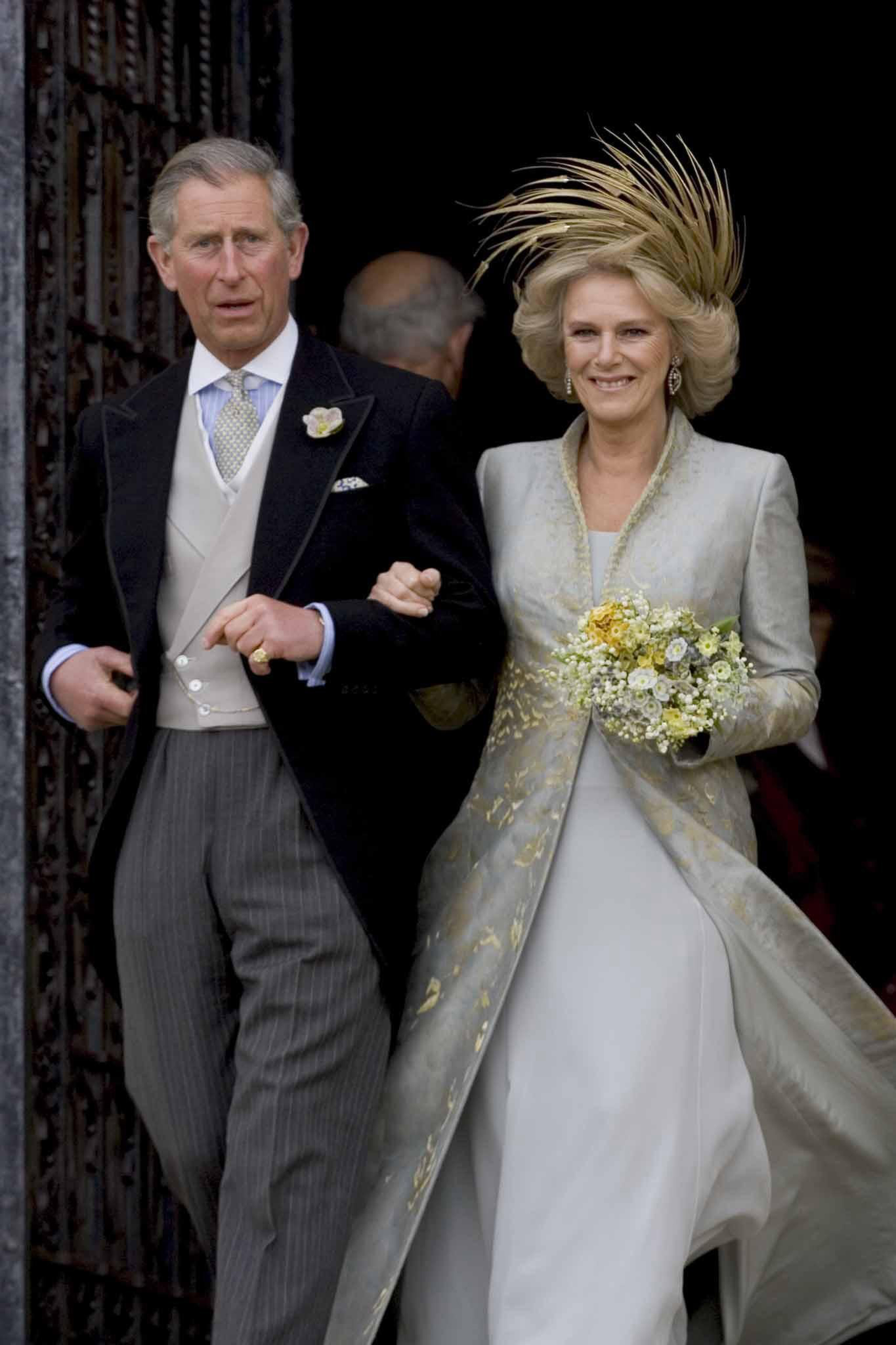 The Prince of Wales and his bride Camilla, Duchess of Cornwall leave St George's Chapel in Windsor, following their wedding