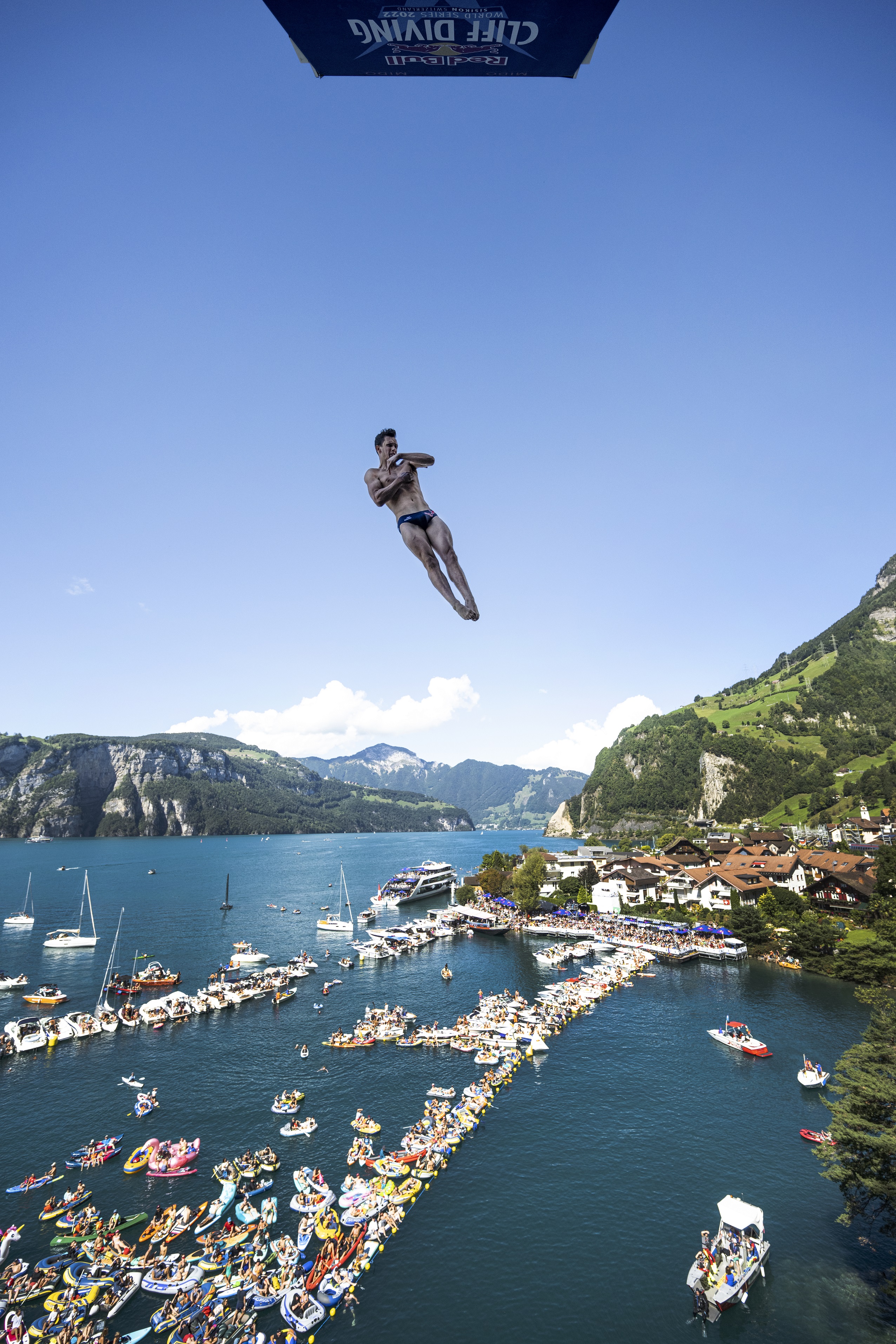 Aidan Heslop of the UK dives from the 27 metre platform during the final competition day of the sixth stop of the Red Bull Cliff Diving World Series in Sisikon, Switzerland on September 11, 2022. 