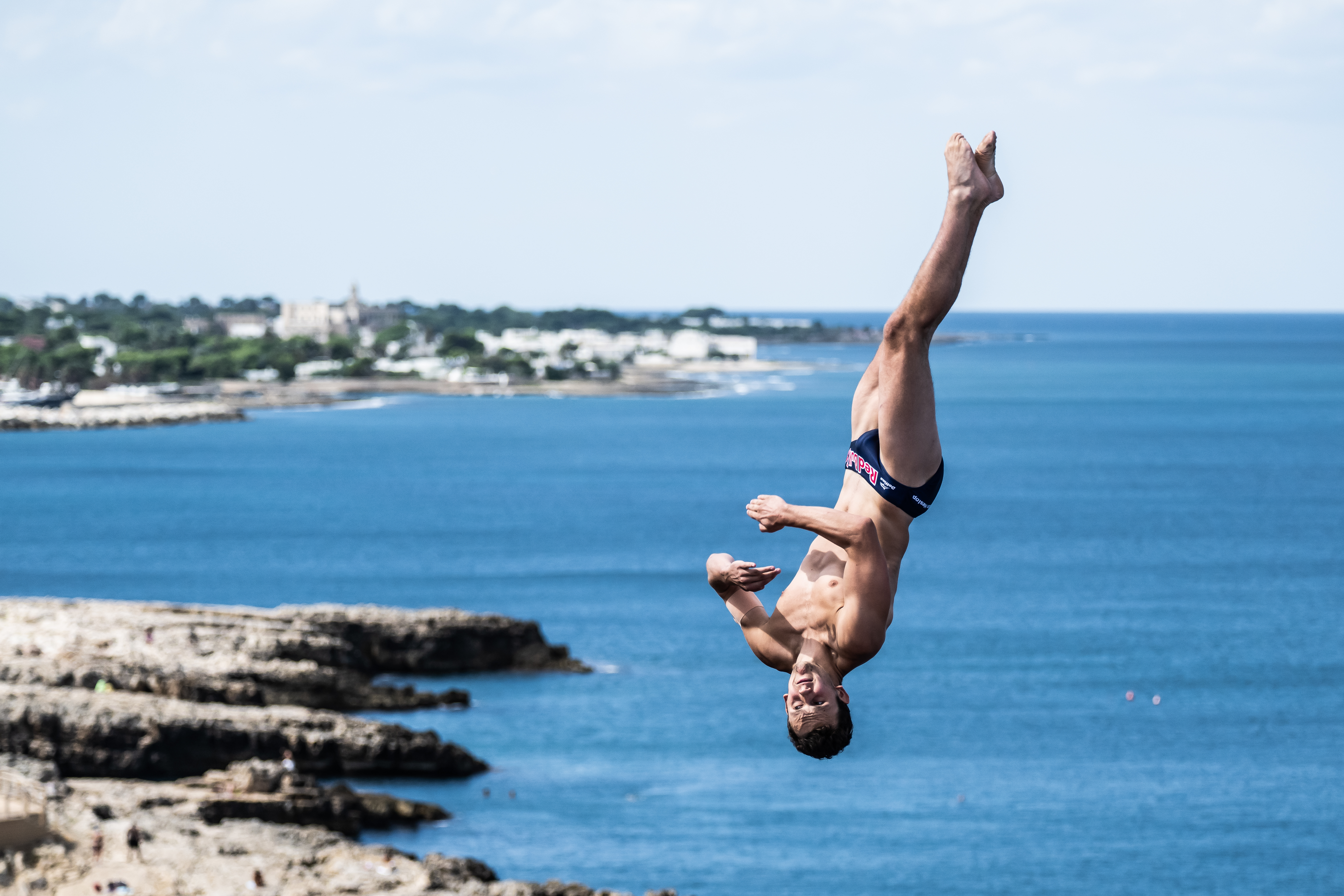 Aidan Heslop dives from the 28 metre platform during the final competition day of the seventh stop of the Red Bull Cliff Diving World Series at Polignano a Mare, Italy.