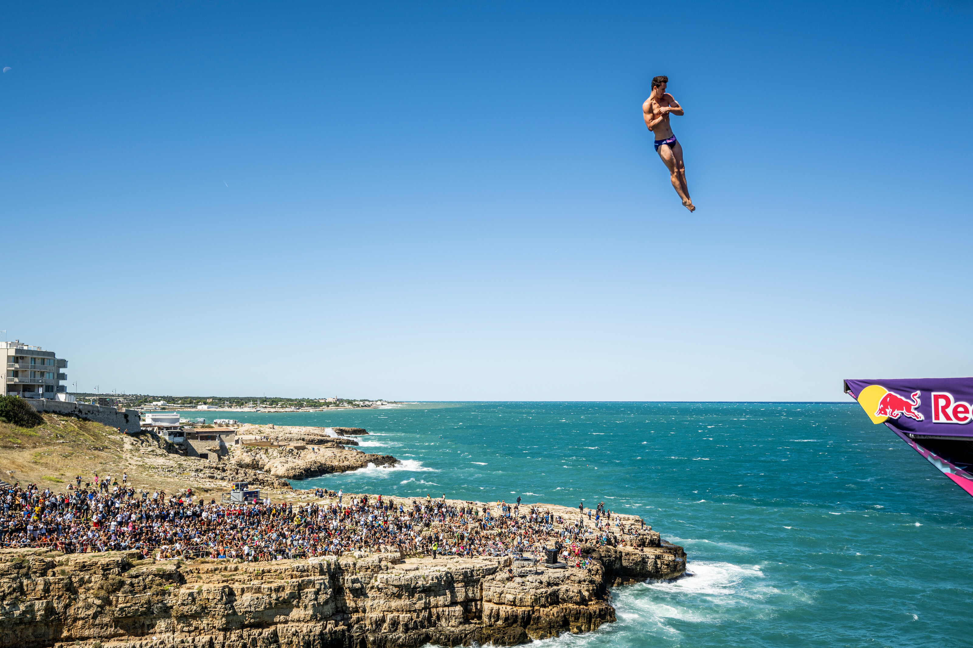 Aidan Heslop dives from the 28 meter platform during the final competition day of the seventh stop of the Red Bull Cliff Diving World Series at Polignano a Mare, Italy. 