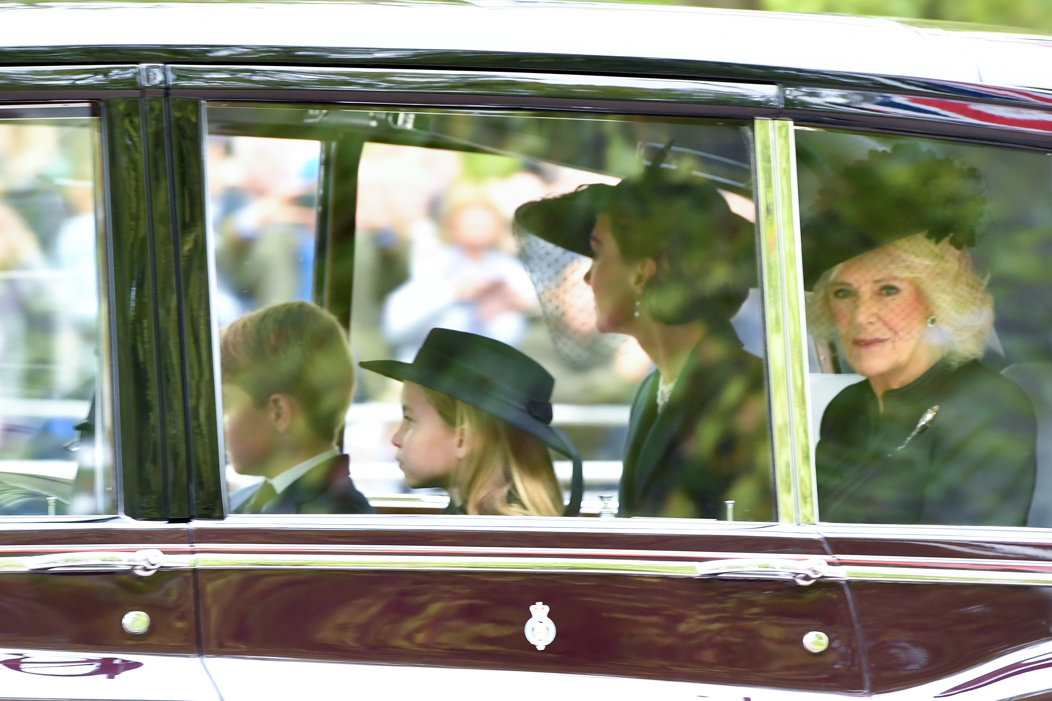 Princess Charlotte, Prince George, the Princess of Wales and the Queen Consort 