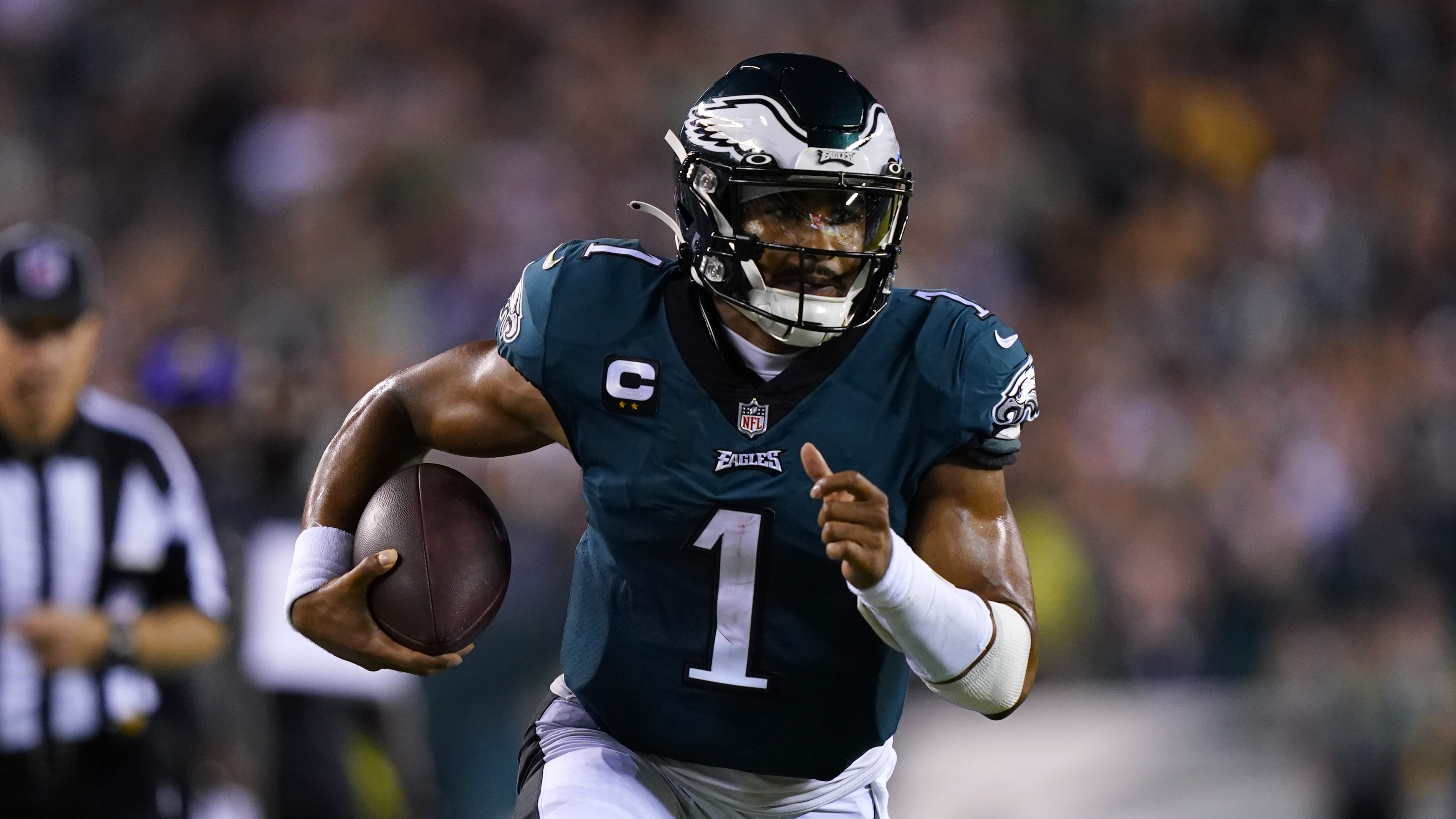 Philadelphia Eagles quarterback Jalen Hurts (1) runs up field during the first half of an NFL football game against the Minnesota Vikings on Monday