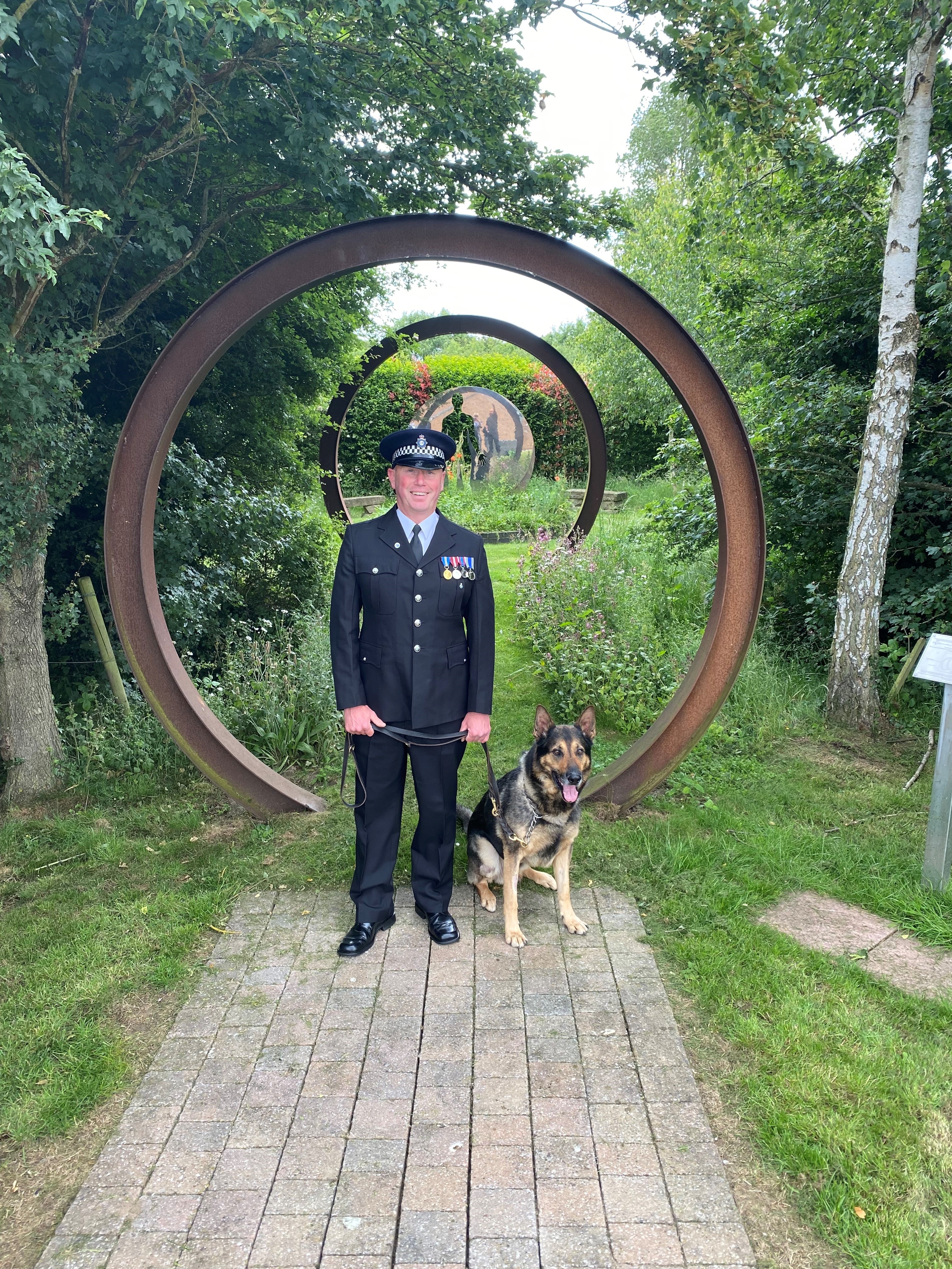 PC Ian Sweeney with his German Shepherd RPD Logan.