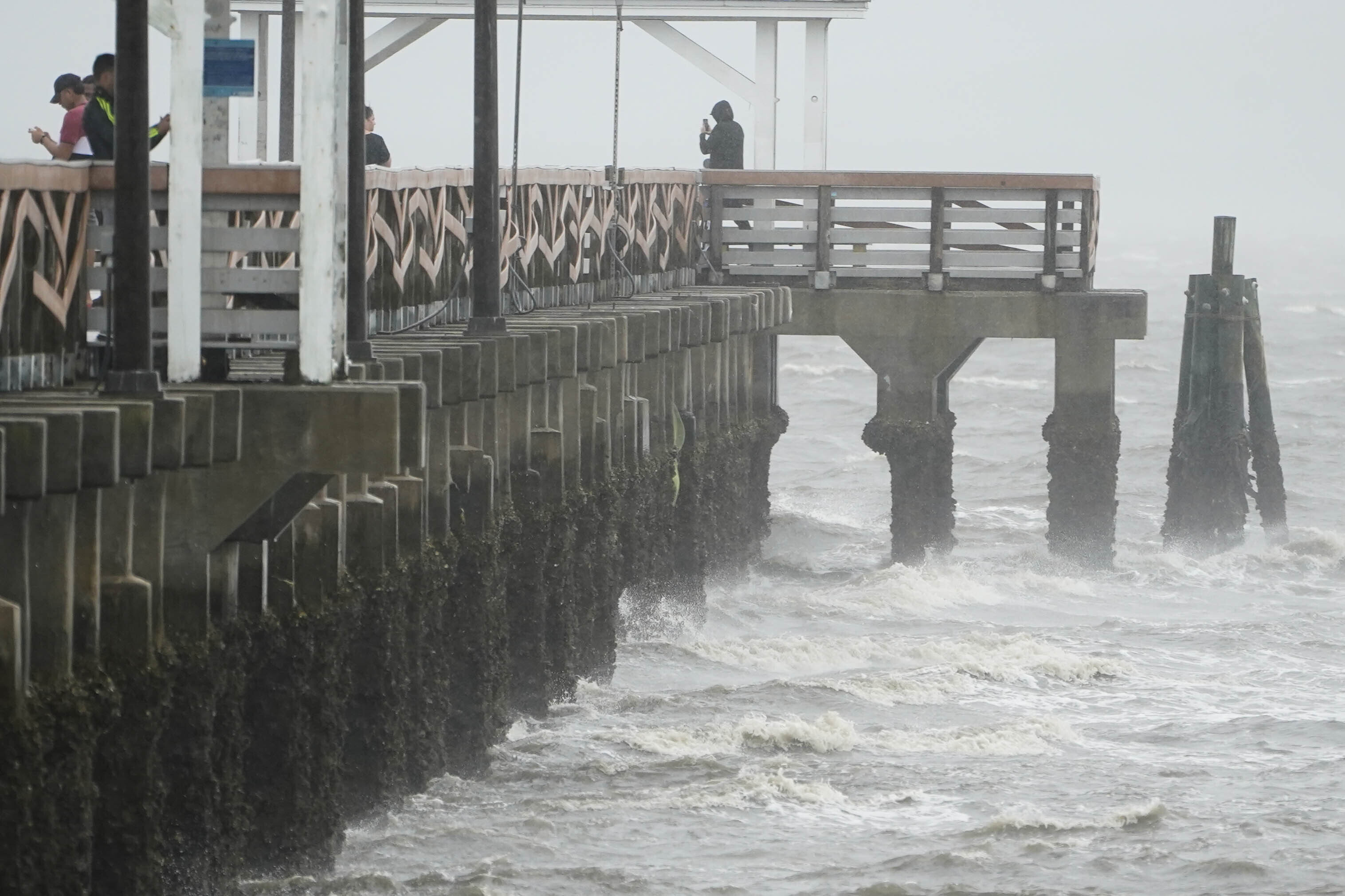 Waves crash along the Ballast Point Pier ahead of Hurricane Ian in Tampa, Florida