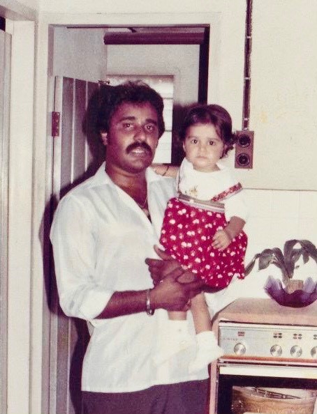 Navinder as a child with her late father