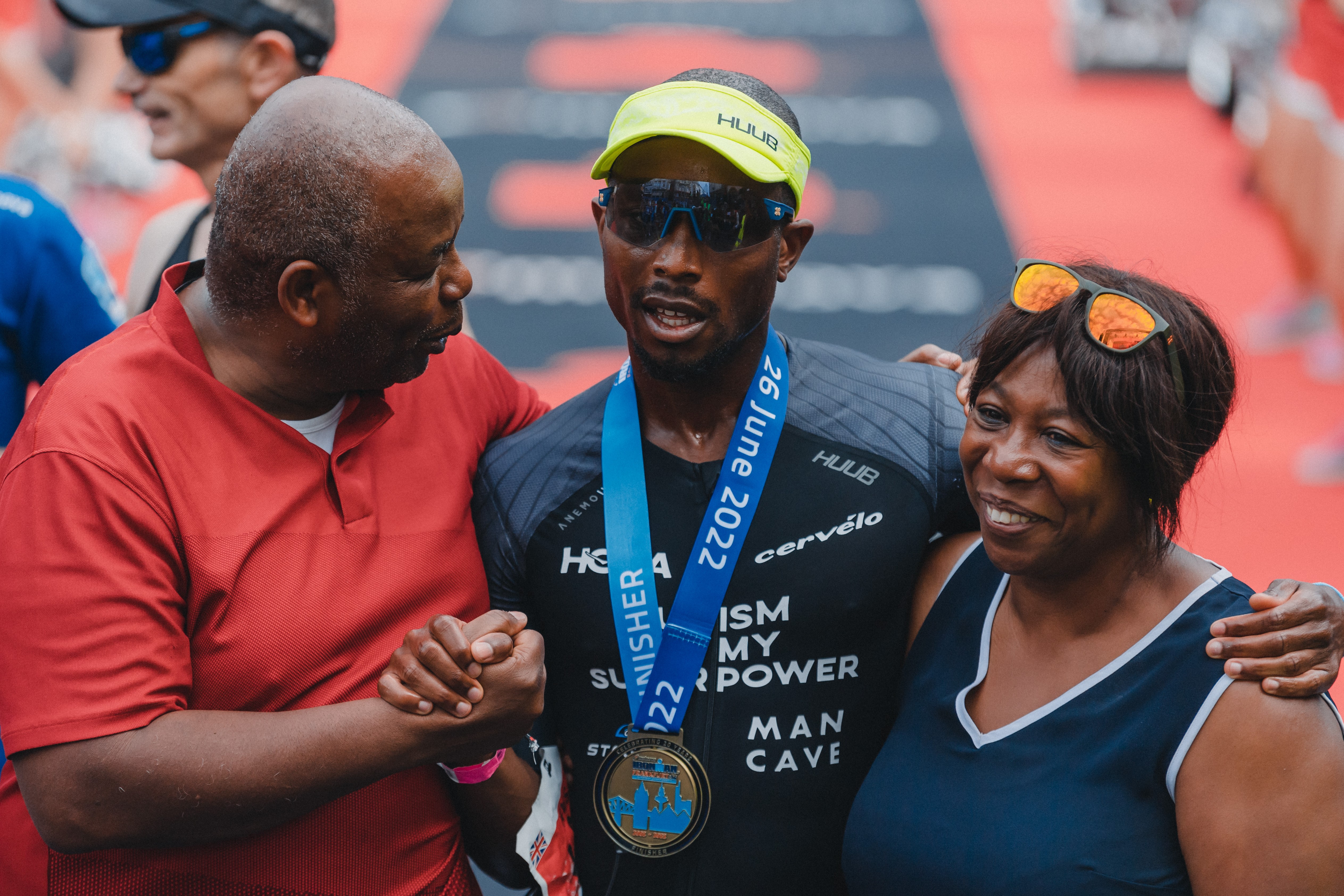 Sam Holness (centre) with his parents Tony and Marilyn