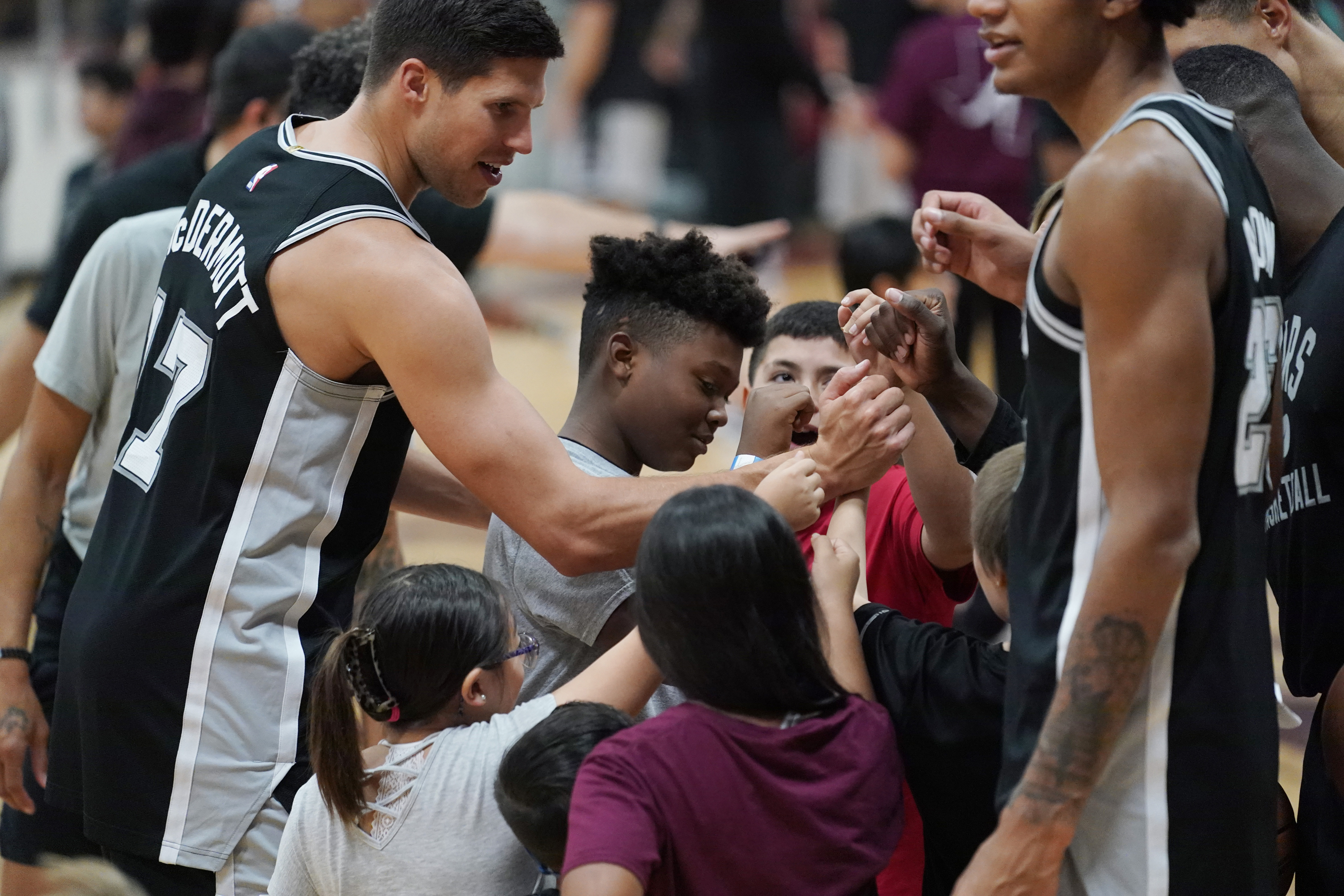 The Spurs team posed for photos with the pupils