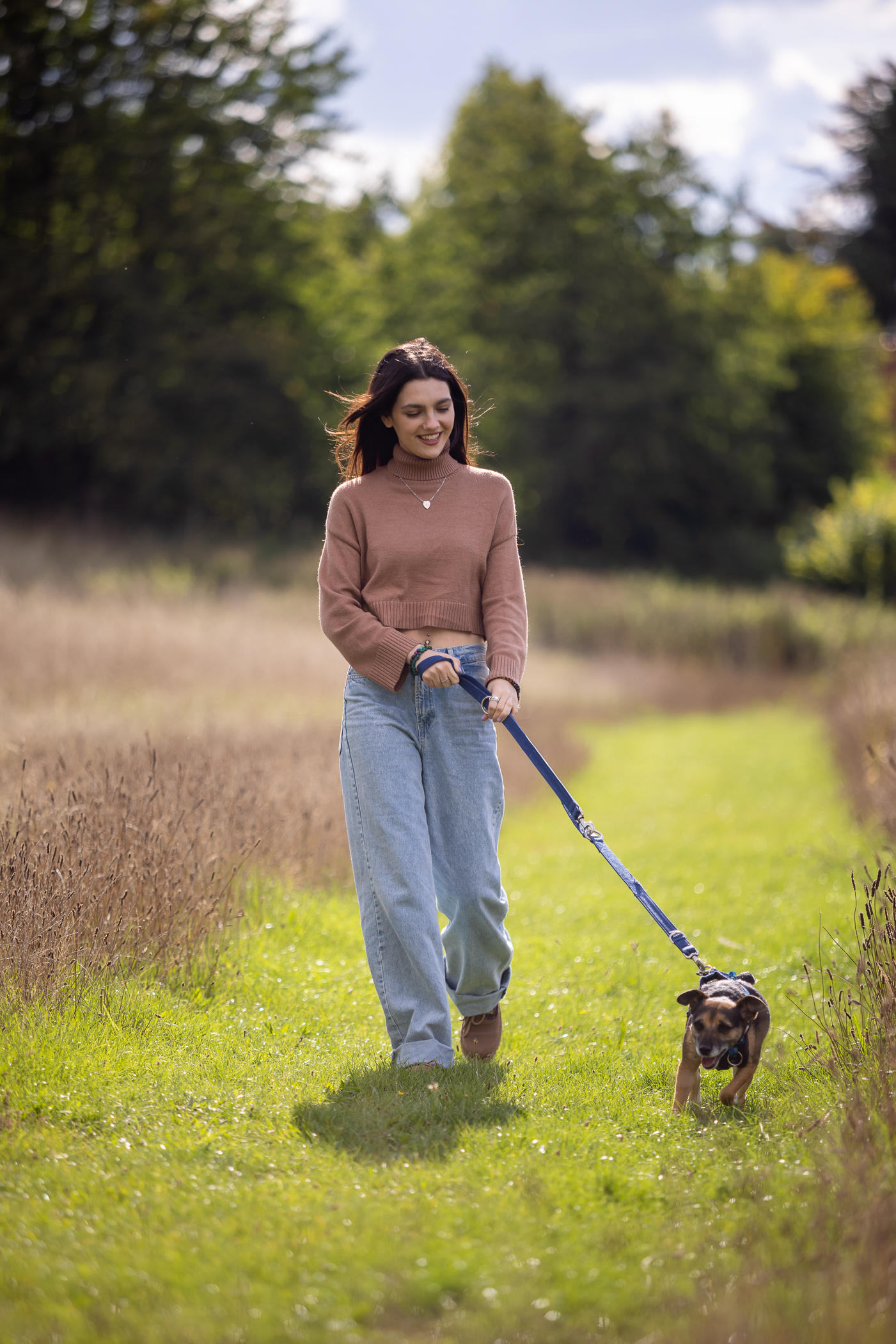Emily Carey walking Tilly the Dog at a Blue Cross rehoming centre