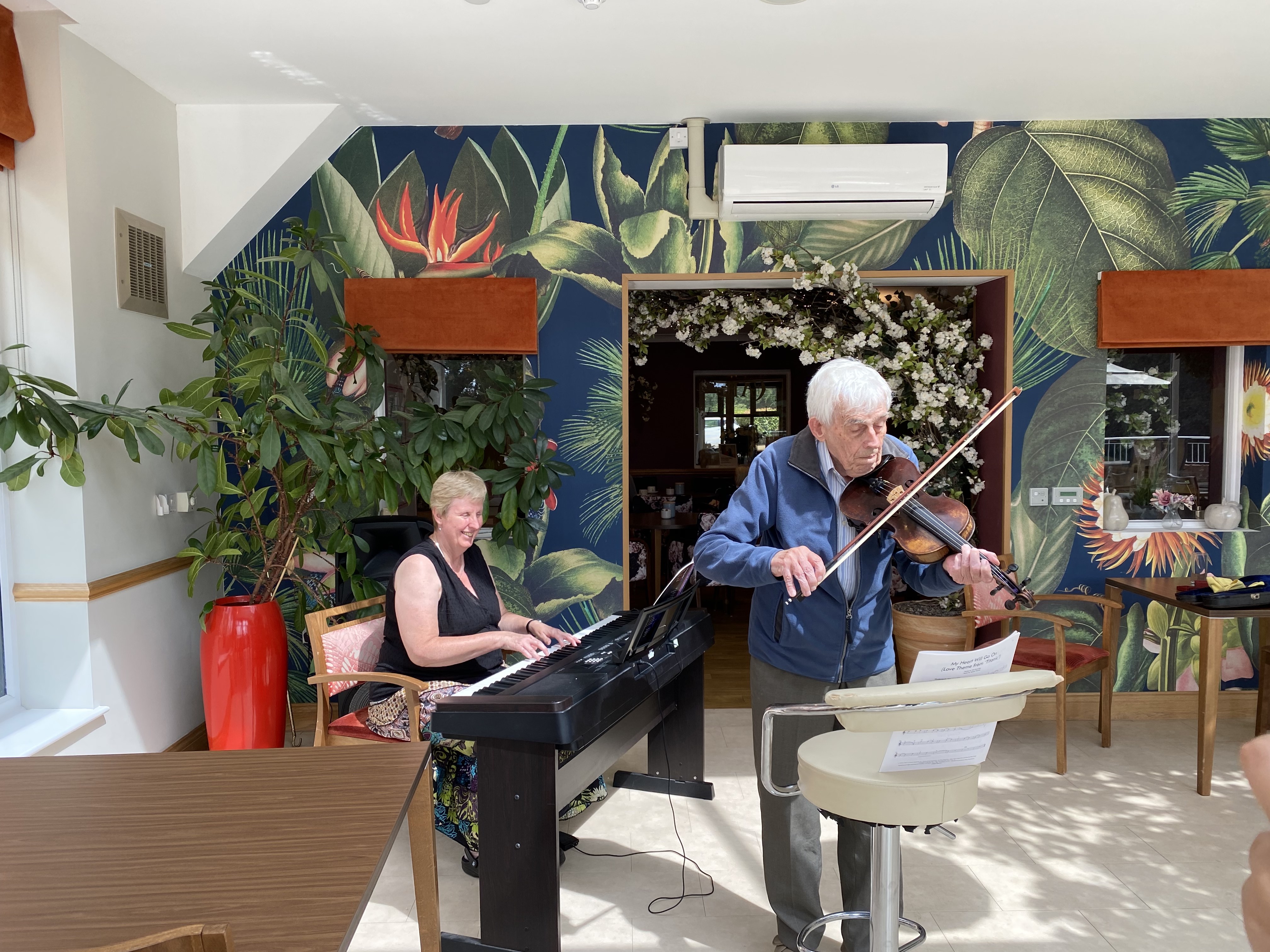 Woman and man playing music together