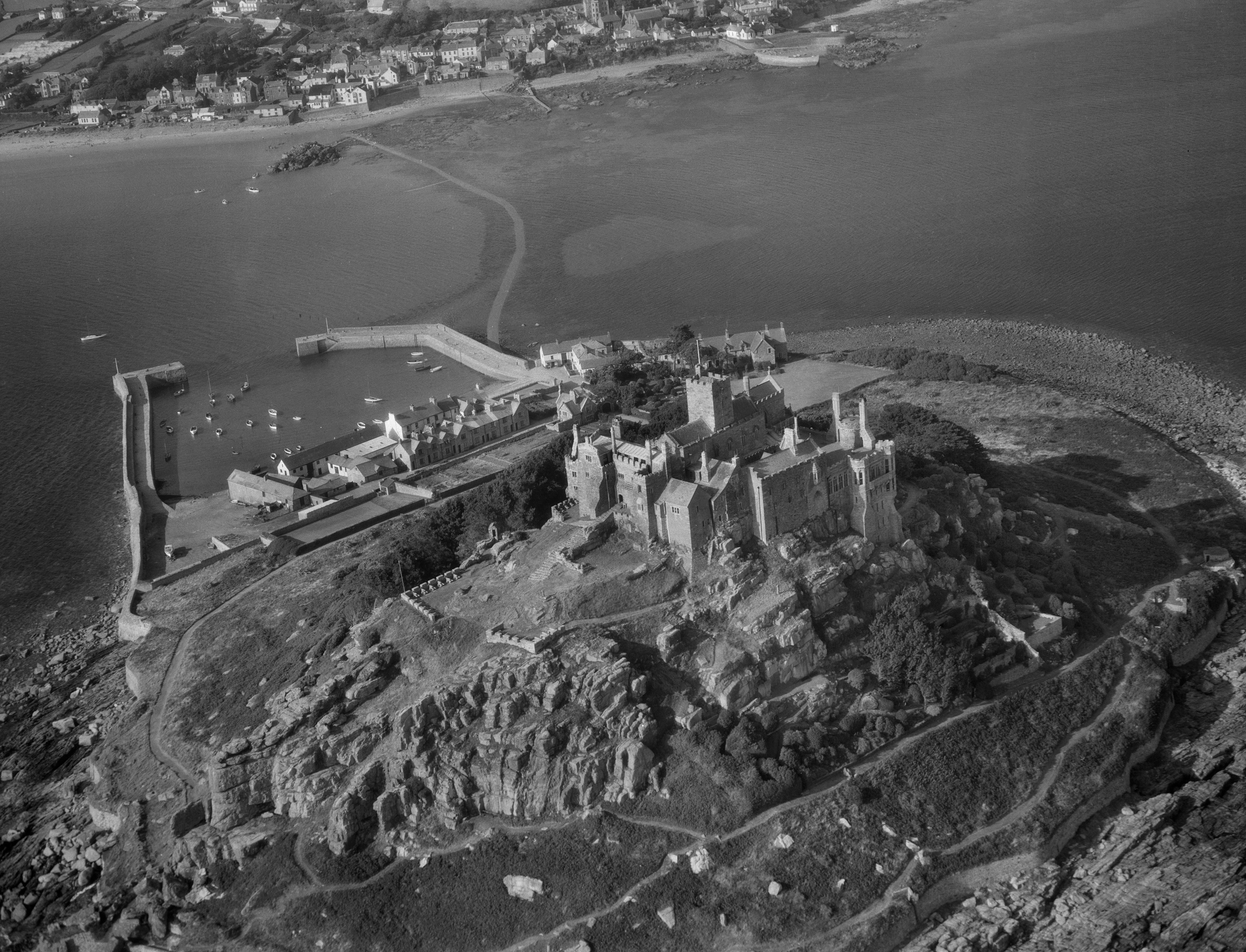 St Michael’s Mount in Cornwall remains a popular tourist destination (Historic England Archive/Harold Wingham Collection/PA).