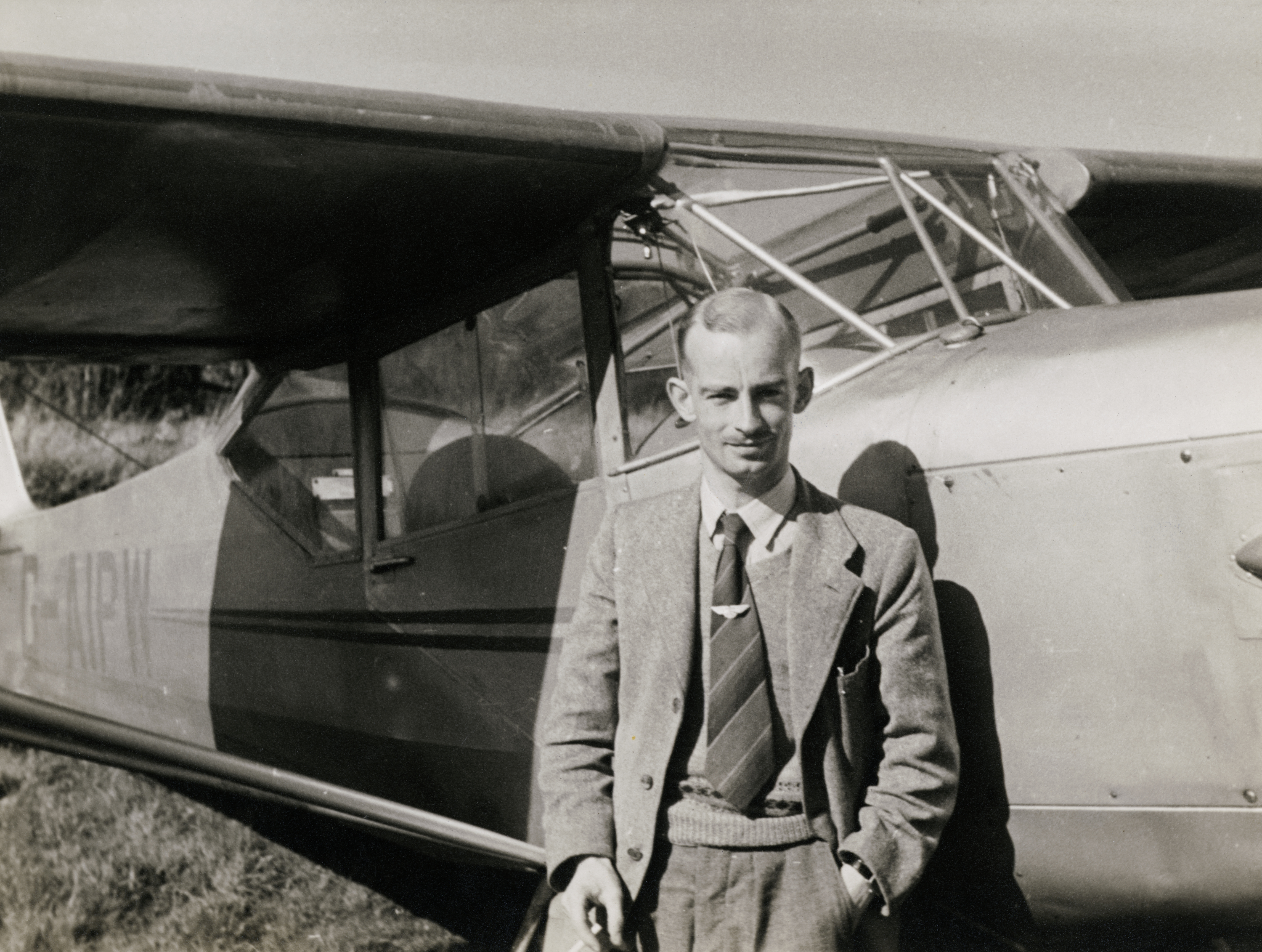 Harold Wingham photographed standing beside an Auster 5J-160 light aircraft (Historic England Archive/Harold Wingham Collection/PA)