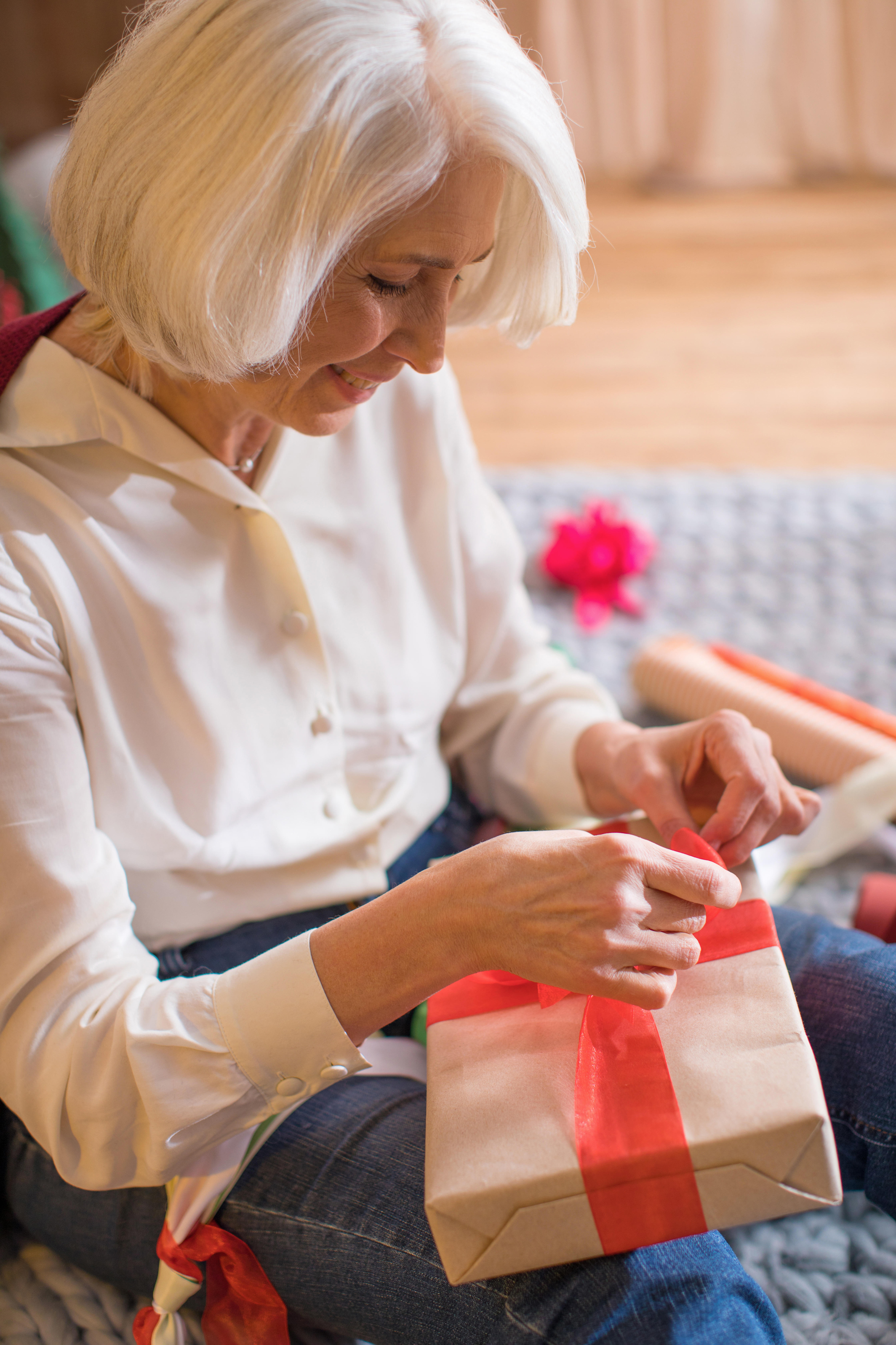 woman wrapping Christmas present