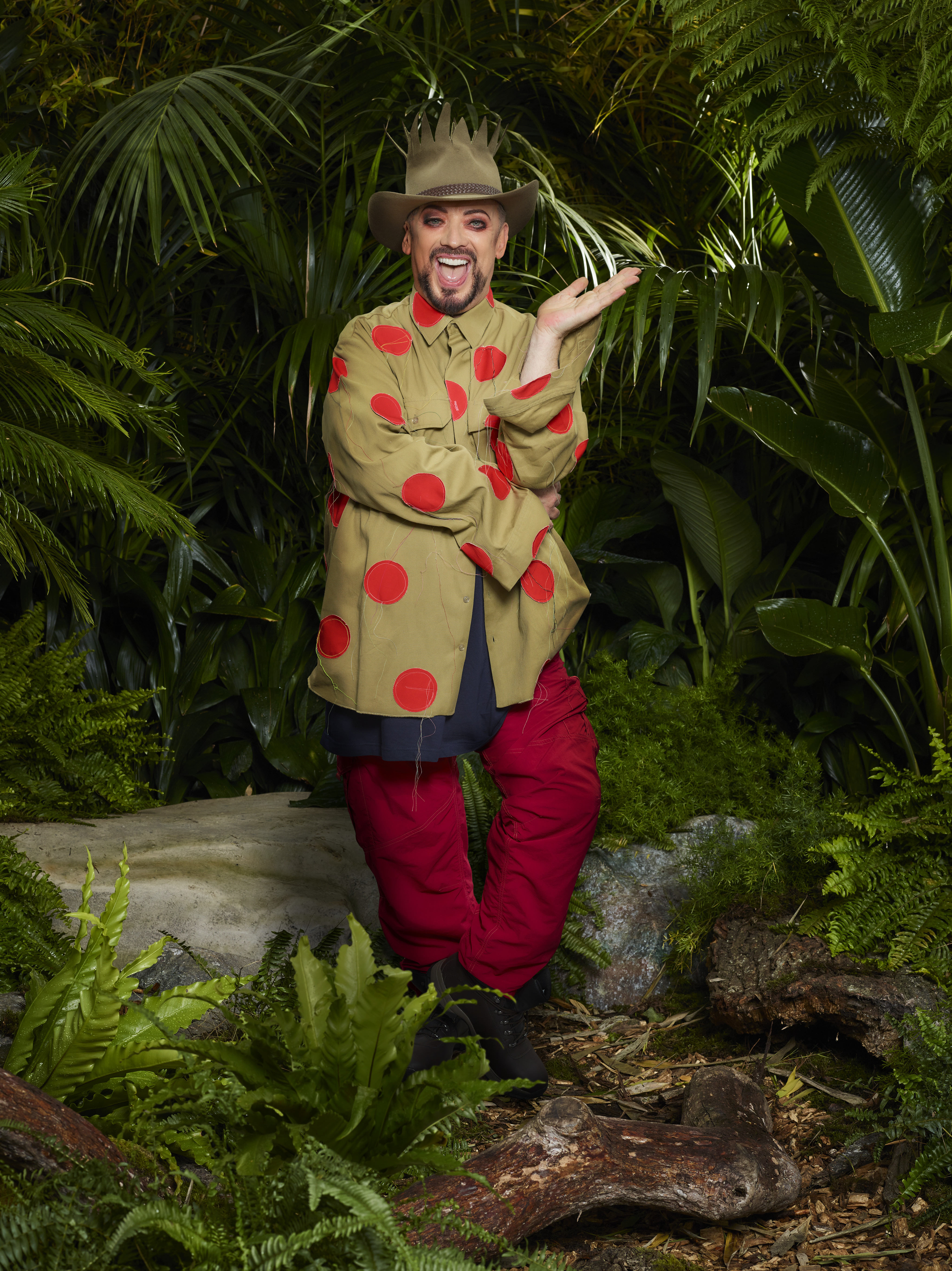 Boy George wearing red polka dots in the jungle