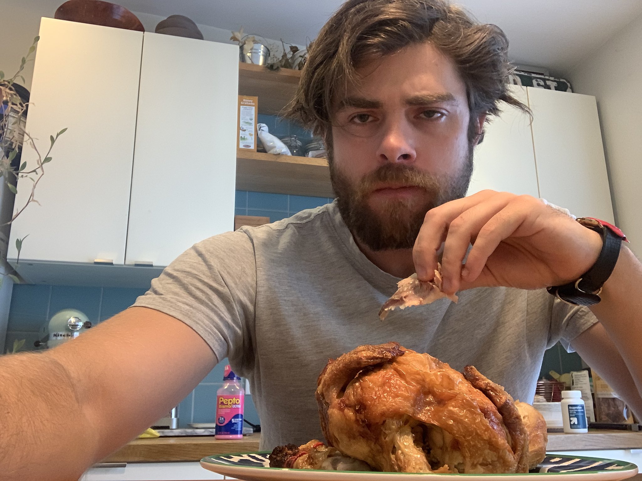 Man sitting behind a chicken