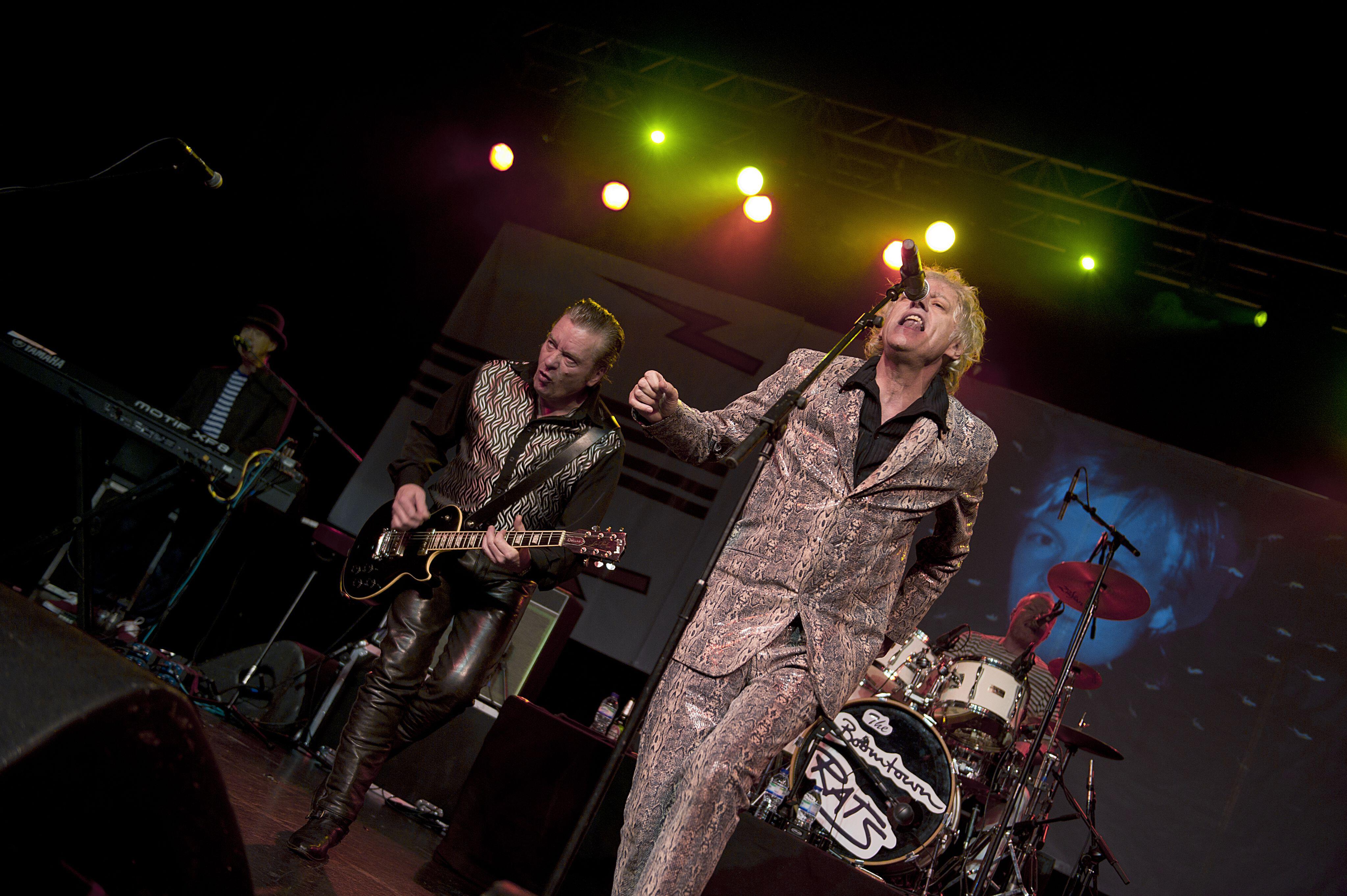 Garry Roberts on stage with Bob Geldof 