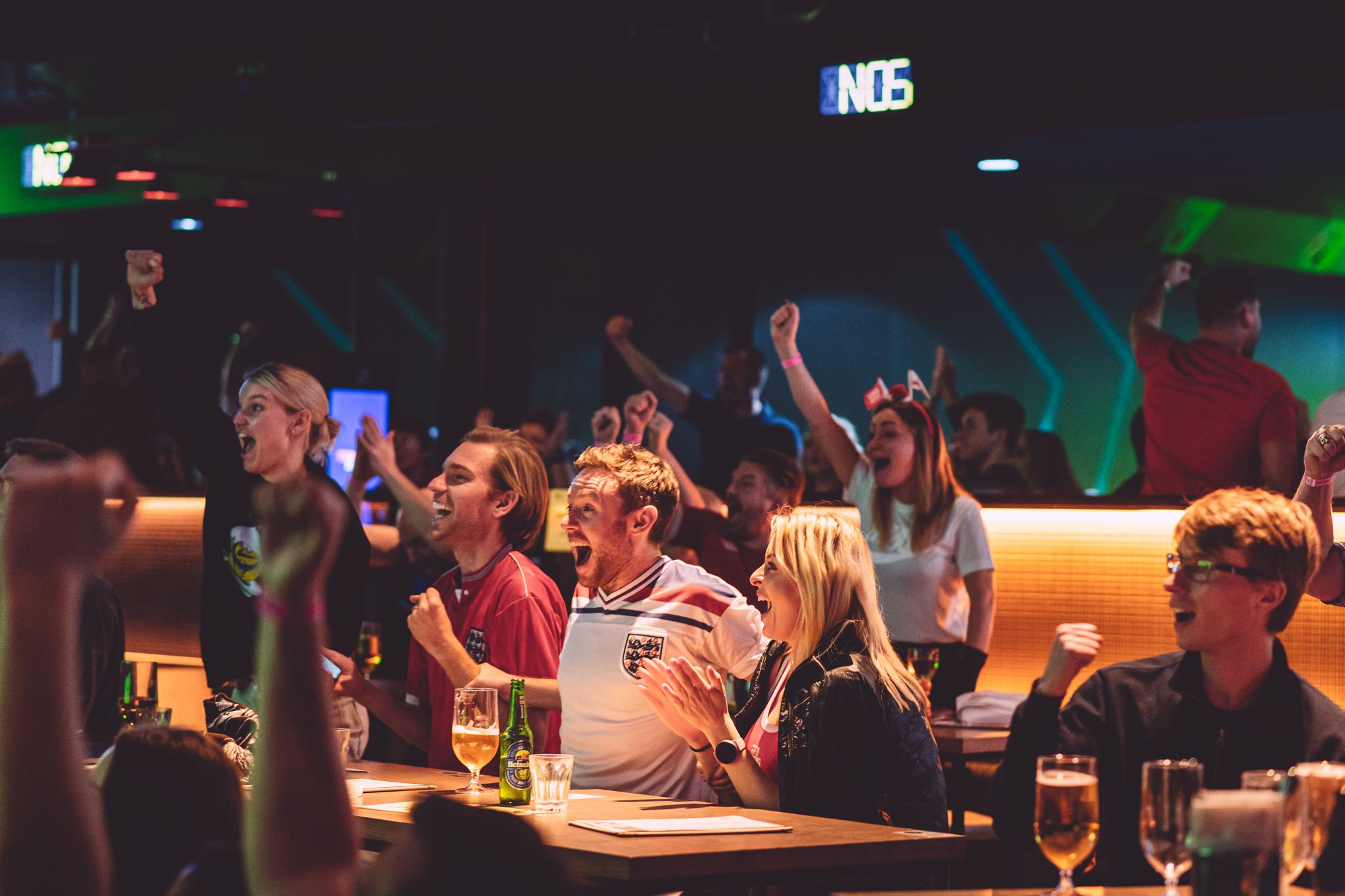 England fans celebrate their team's 6-2 win against Iran in their opening World Cup group match at the TOCA Social venue at the O2 in London