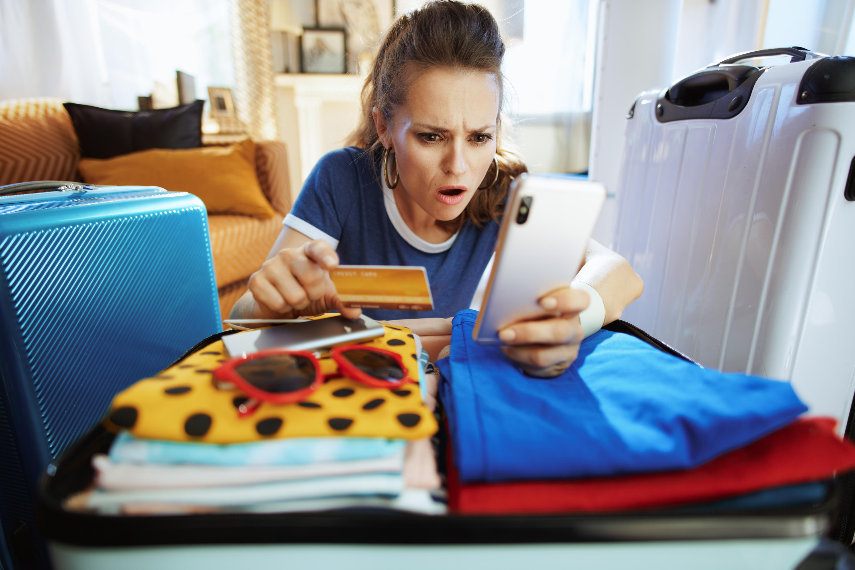 Shocked woman looking at phone