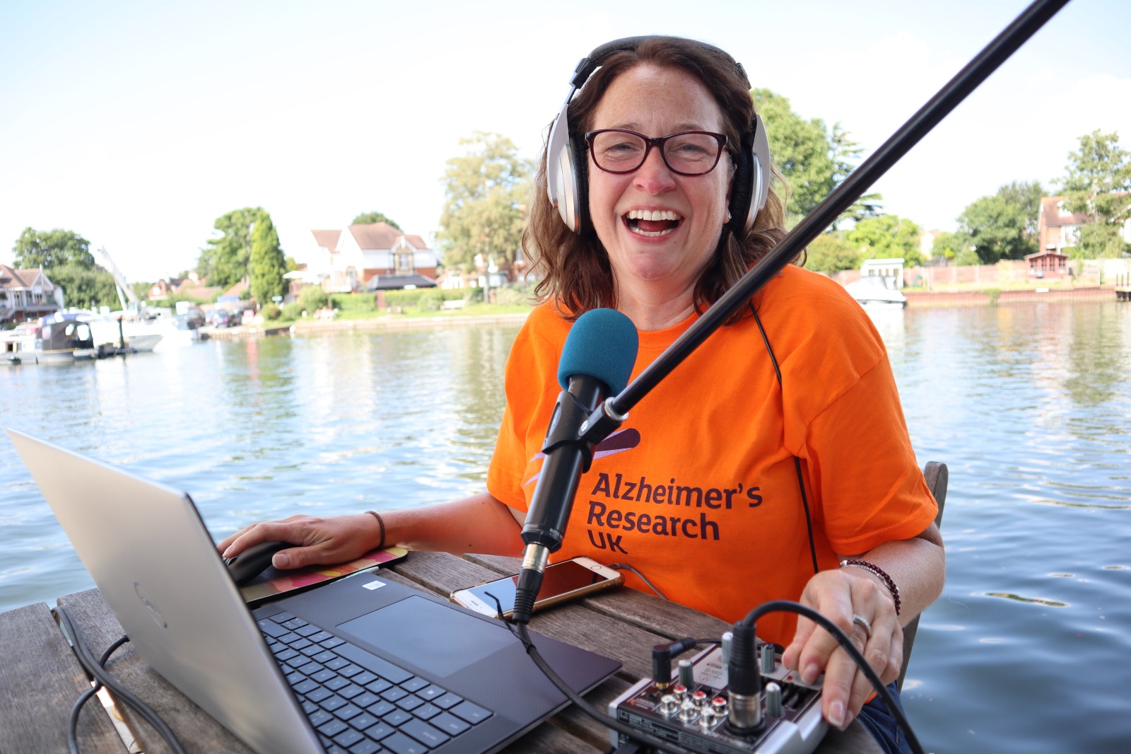 Woman sitting behind a microphone