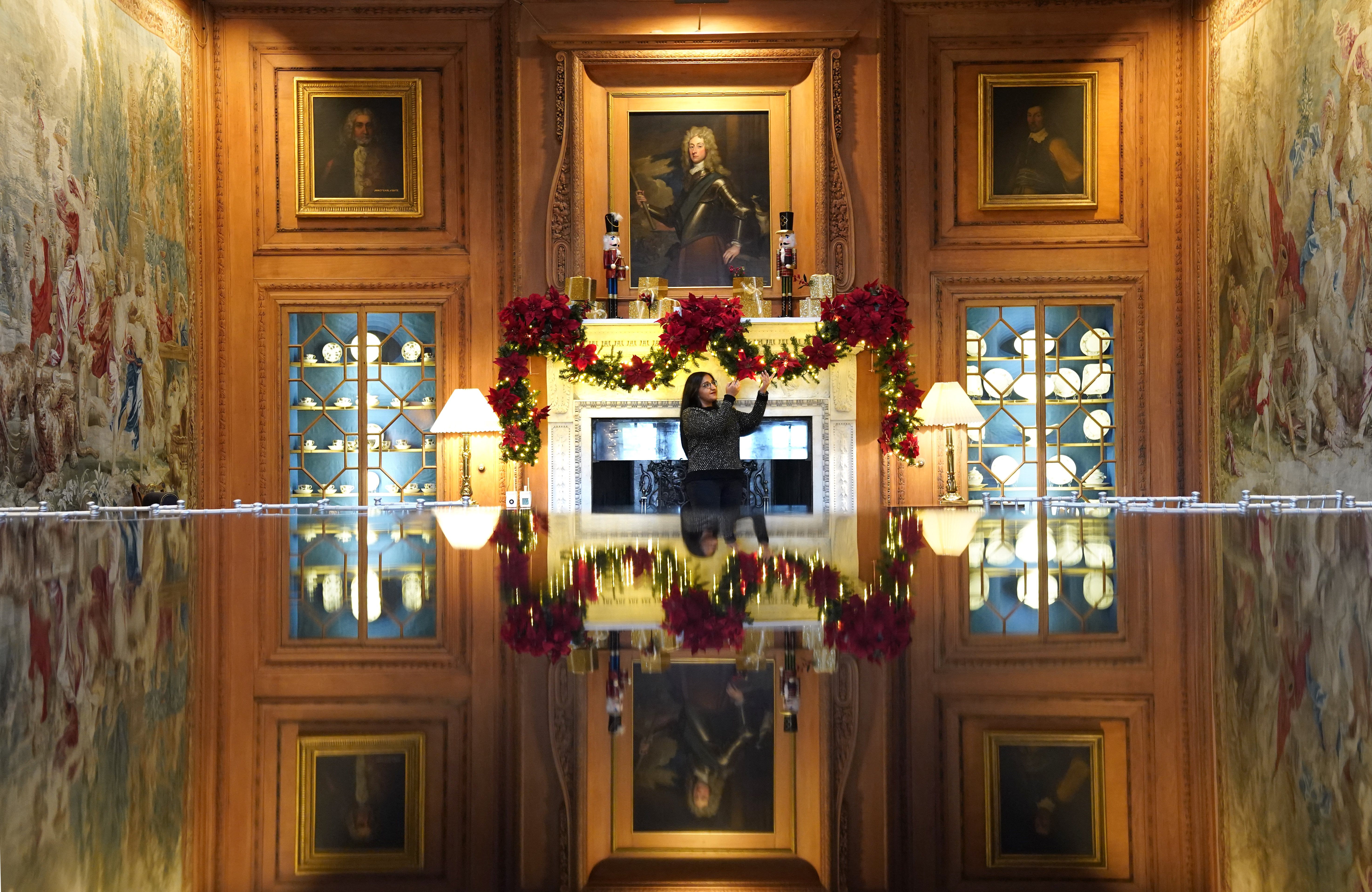 Collections manager Satinder Kaur puts the finishing touches to the Christmas displays in The Tapestry Room at Dumfries House