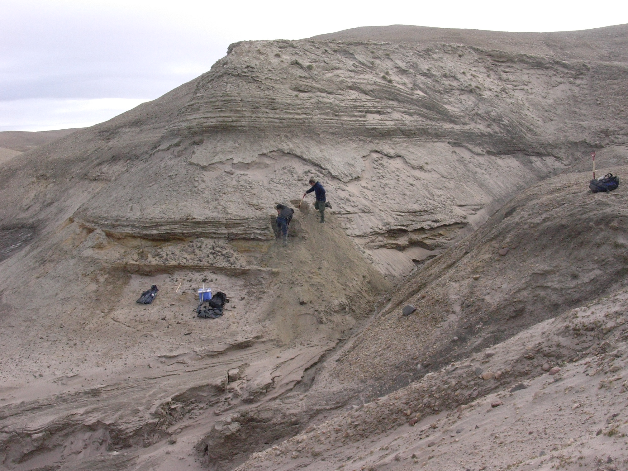 Professors Eske Willerslev and Kurt H. Kjær exposing fresh layers for sampling of sediments. (Professor Svend Funder/ PA)