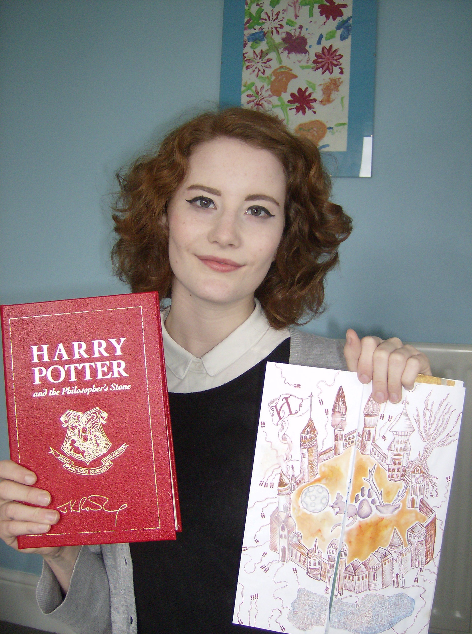 Chloe at the age of 16 with her Harry Potter book prize and entry