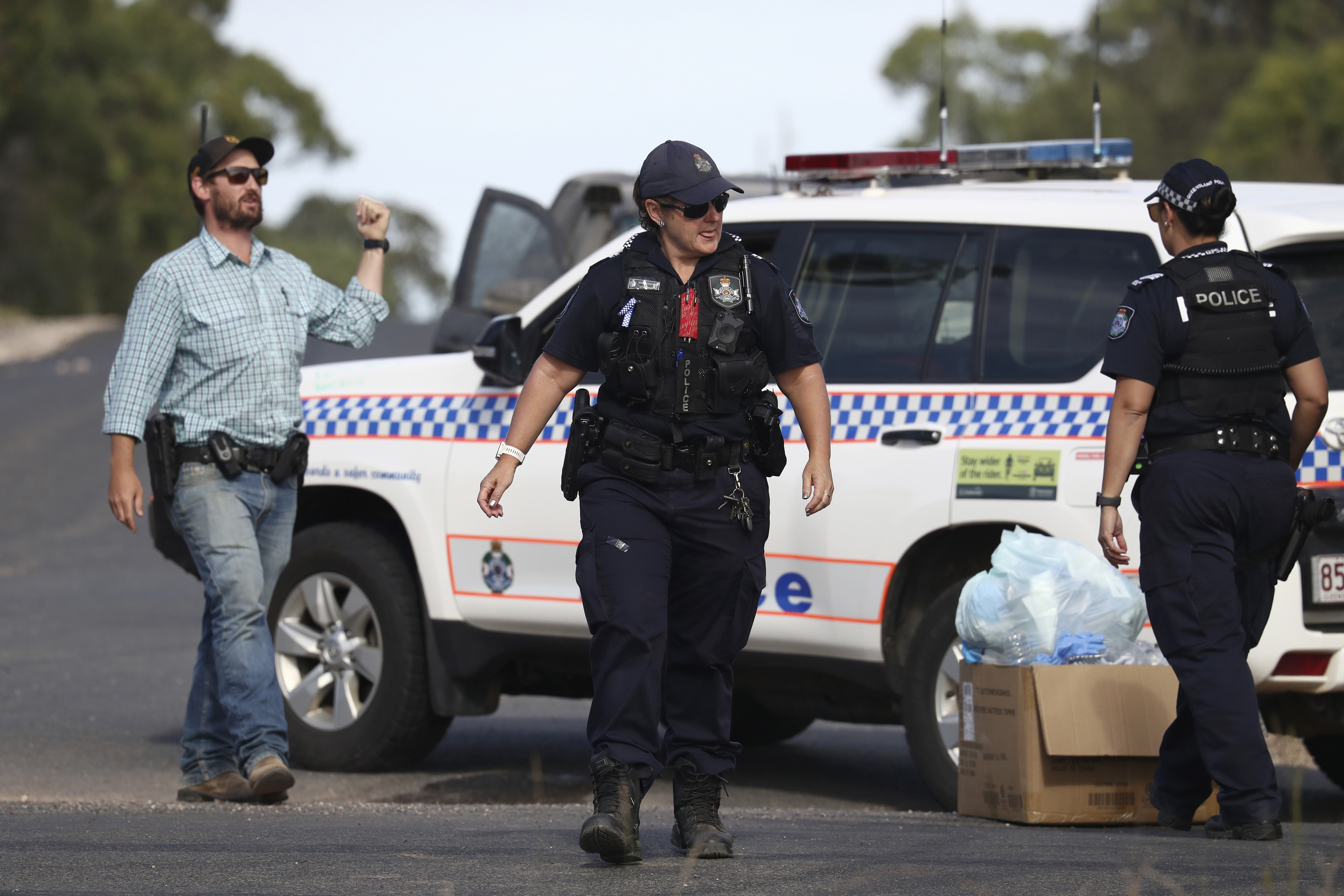 Police work near the scene of the fatal shooting in Wieambilla, Australia