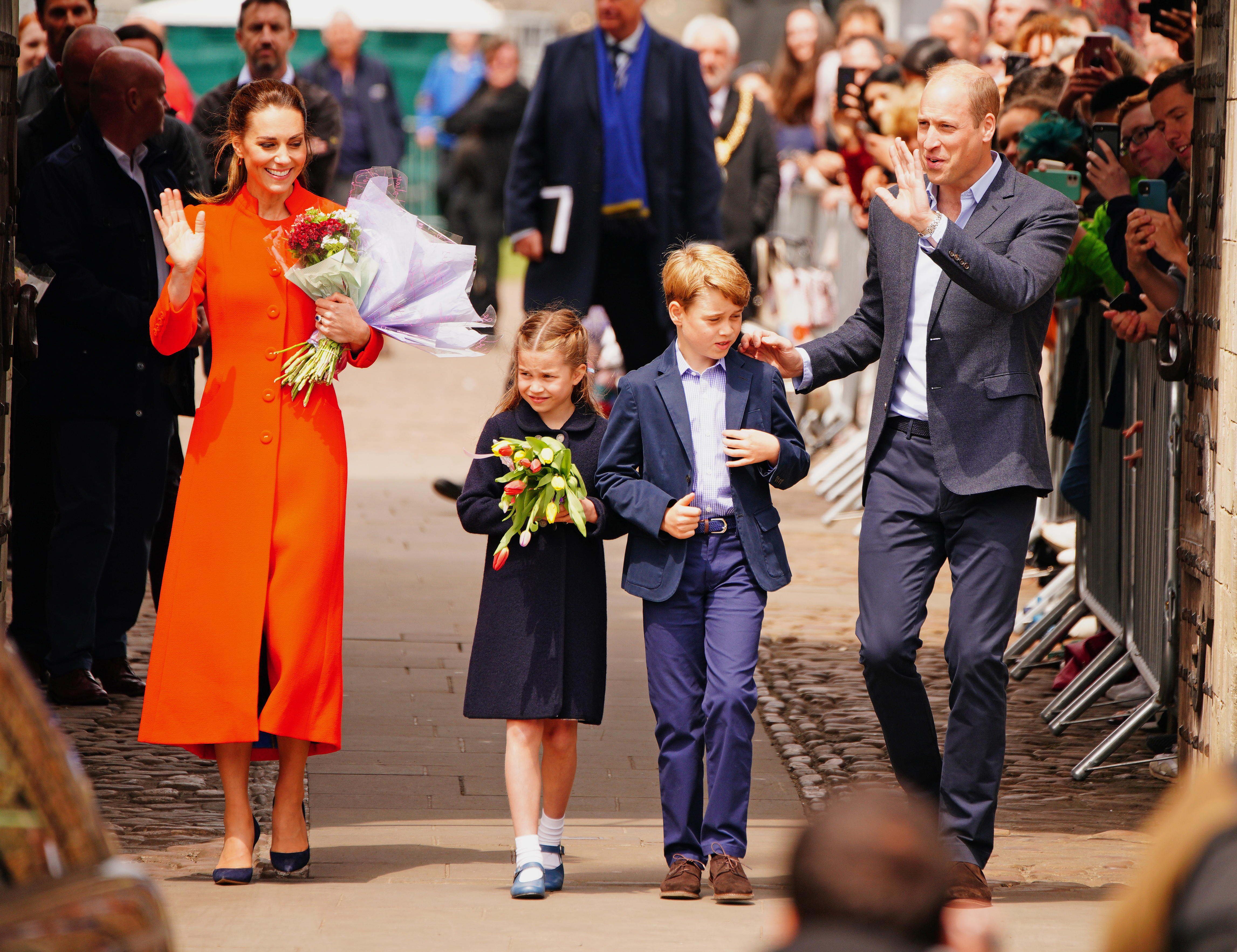 The Duke and Duchess of Cambridge, Prince George and Princess Charlotte speak to wellwishers during their visit to Cardiff Castle