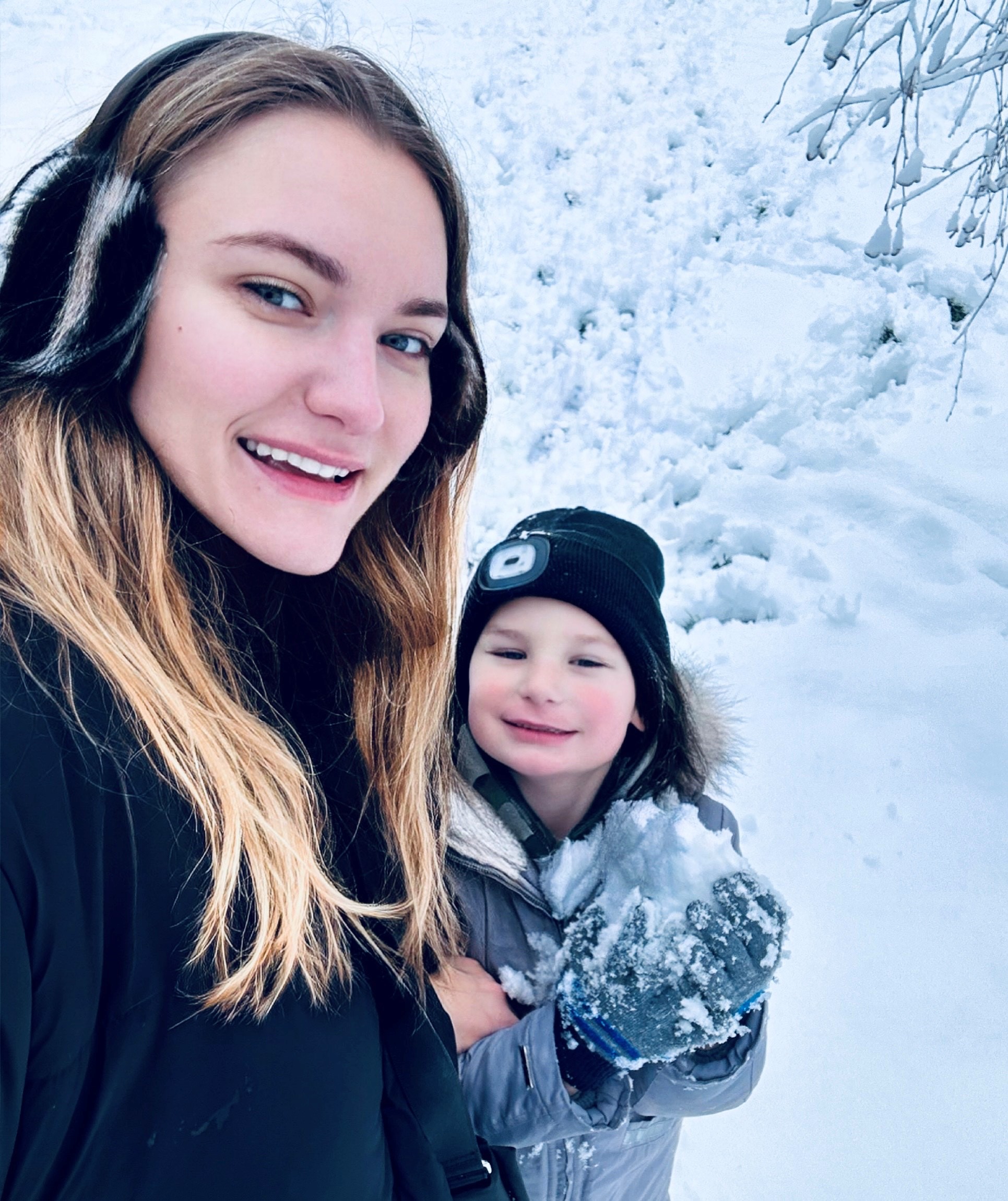Woman with her son in the snow
